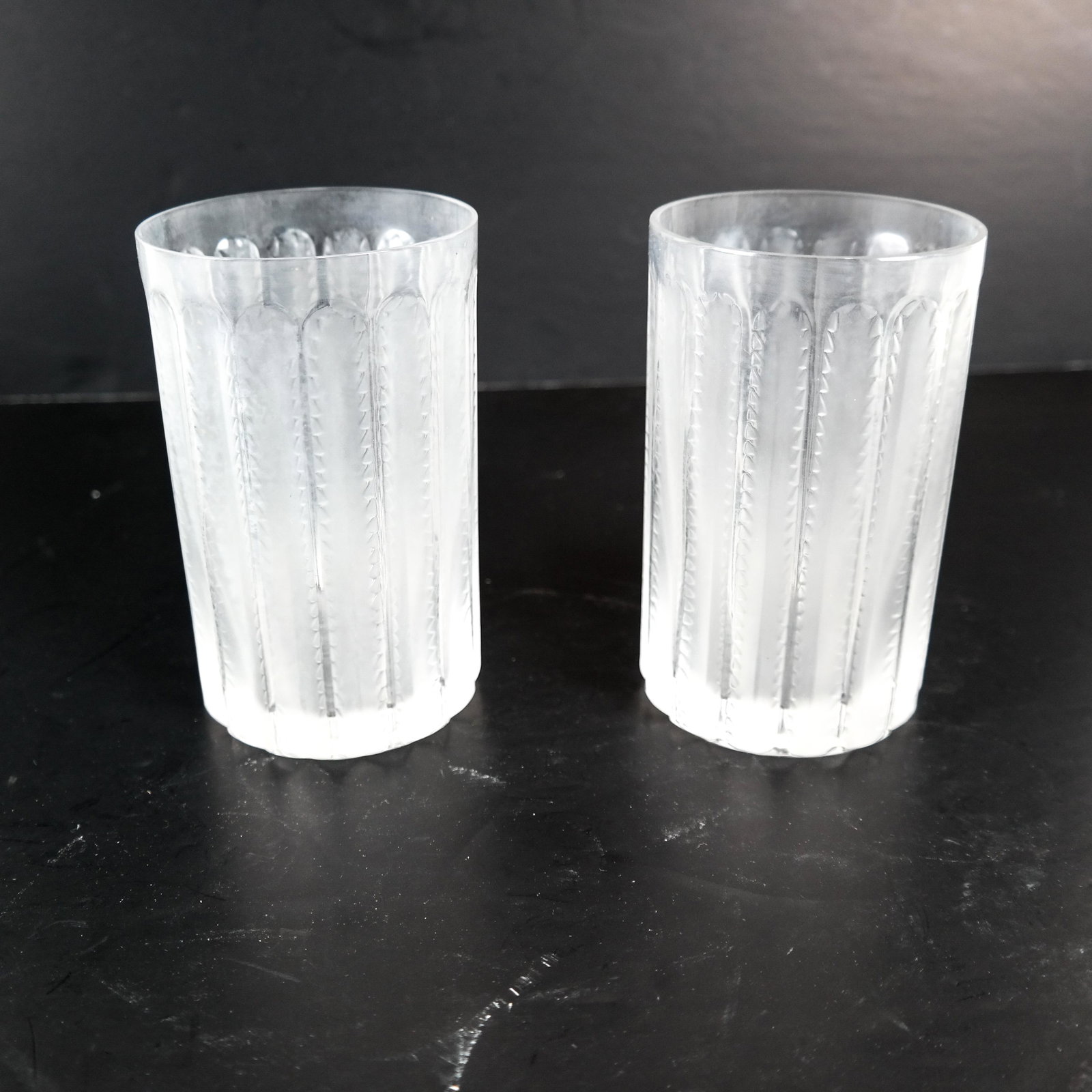 Lalique, France - Two Water Glasses: Lalique France two water glasses having etched feather pattern. [5 x 3 (dia) inches]. In good condition.