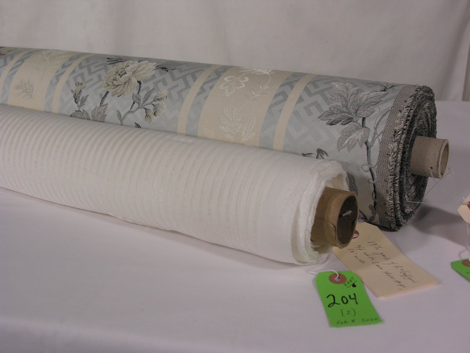 Rogers & Goffigon Sheer and FRET: 1) 19 1/2 yards of Rogers & Goffigon's off white linen sheer stripe at 58-inch width. Compliments the Italian lampas in this lot. 2) 21 yards of FRET's Fabrics "Modern Floral" #47-2, an Italian broad-
