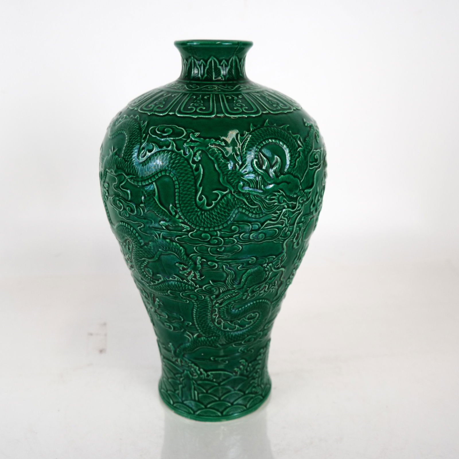 Deep Green Glazed Chinese Vase: Deep green glazed Chinese vase. [11 1/2 x 6 1/2 (dia) inches]. In good condition.