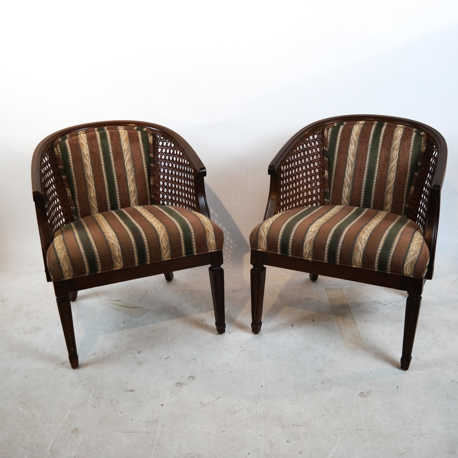 Pair of Carved & Upholstered Bergeres: Pair of carved and upholstered bergeres. [29 x 23 1/2 x 22 1/2 inches; 17 inches to seat]. In good condition.