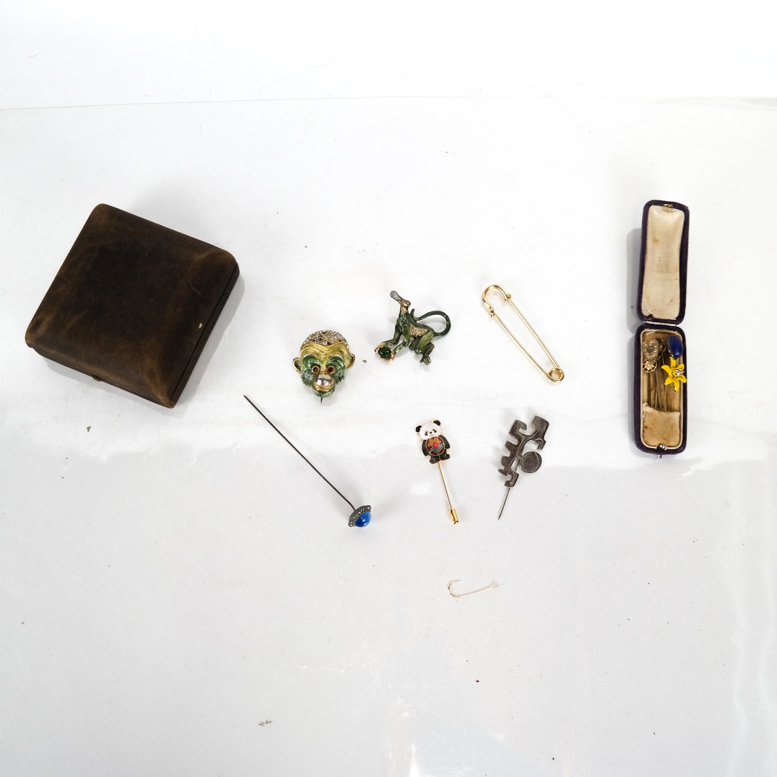 Lot of Pins & Stickpins, Incl. Pierre Cardin: Lot of vintage/antique pins is comprised of 7 stickpins, including Pierre Cardin, a hatpin, a safety pin, an enamel monkey pin (needs repair) and a fine (possibly gold) fishhook.