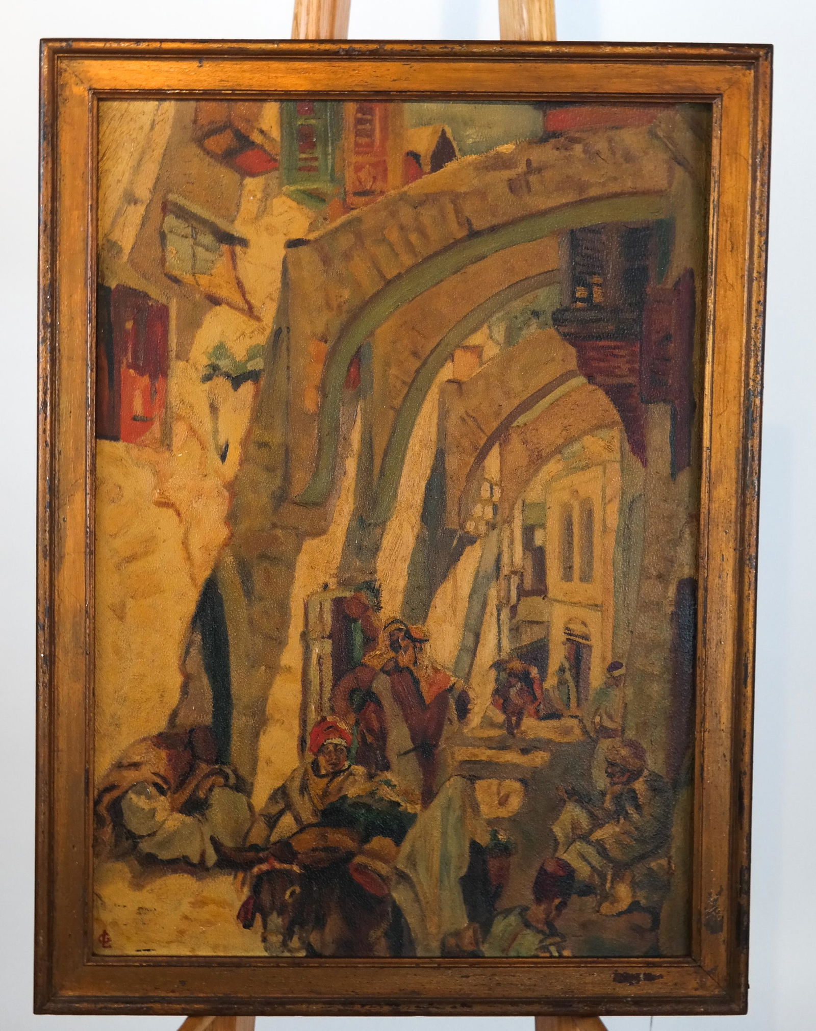 Possibly Georges LACOMBE: Market Scene - O/B: Painting of Middle Eastern market scene, oil on board, signed with "GL" monogram lower left. [Art: 23 x 16 3/8 inches; Frame: 25 5/8 x 19 inches]. Yellowing to surface.