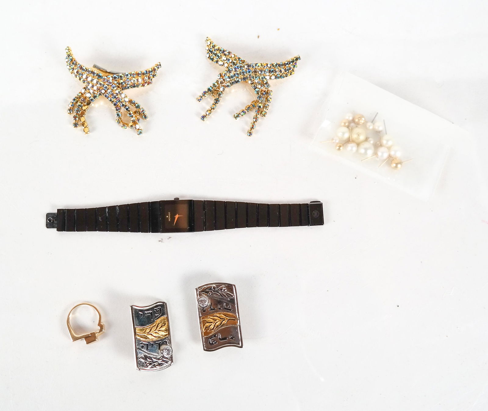 Lot of Costume and 14K Jewelry: Lot of costume and 14K jewelry includes: bag of looses pearls with 14K and pearl studs; pair of costume clips; two Judaic costume pins; 14 K ring; Movado watch.