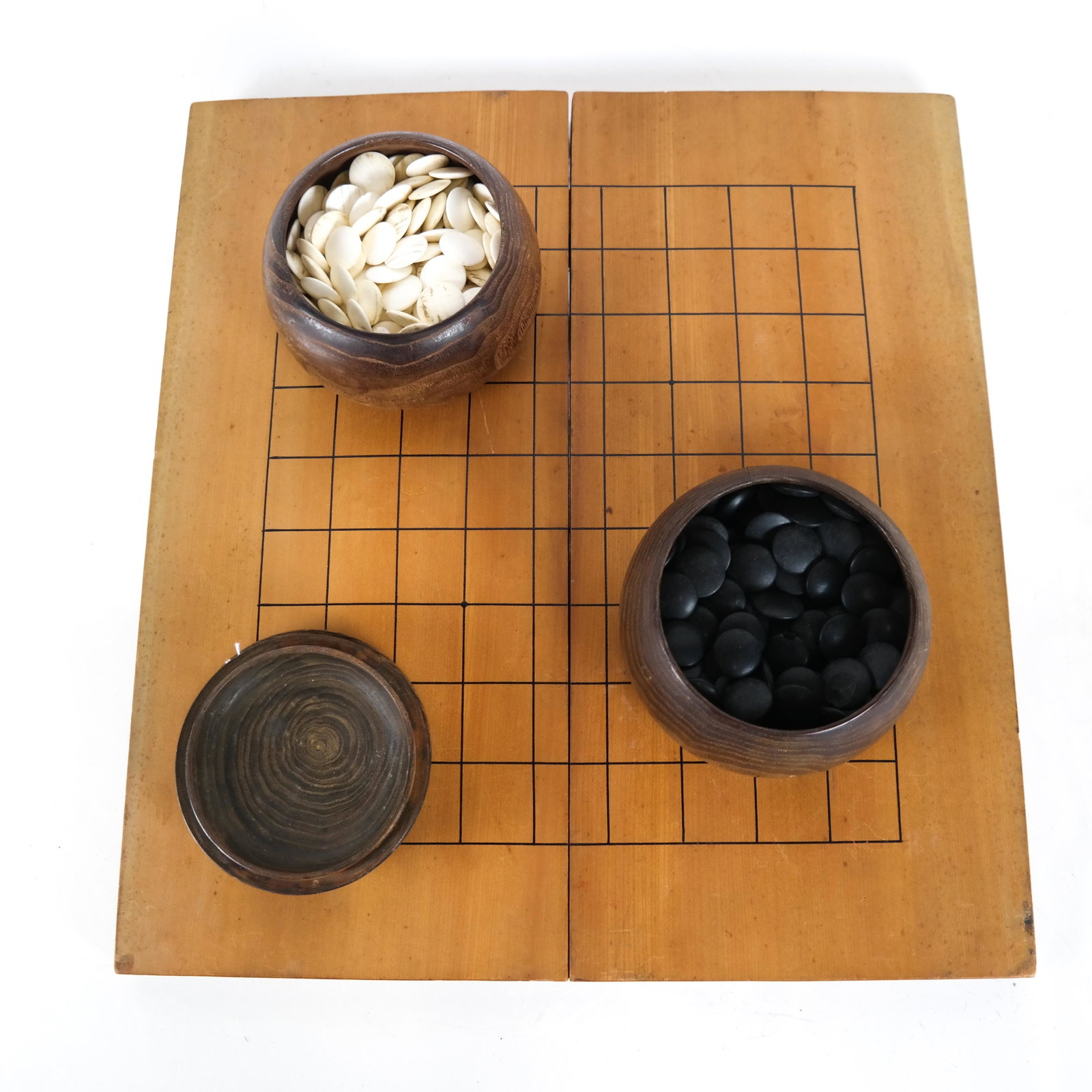 Chinese Wood Board Game with Wooden Tokens: Chinese wood board game with wood tokens, having two wooden bowls containing the tokens. [Game: 2 x 18 1/2 x 9 1/2 inches; Bowl: 3 3/4 x 5 1/2 (dia) inches].