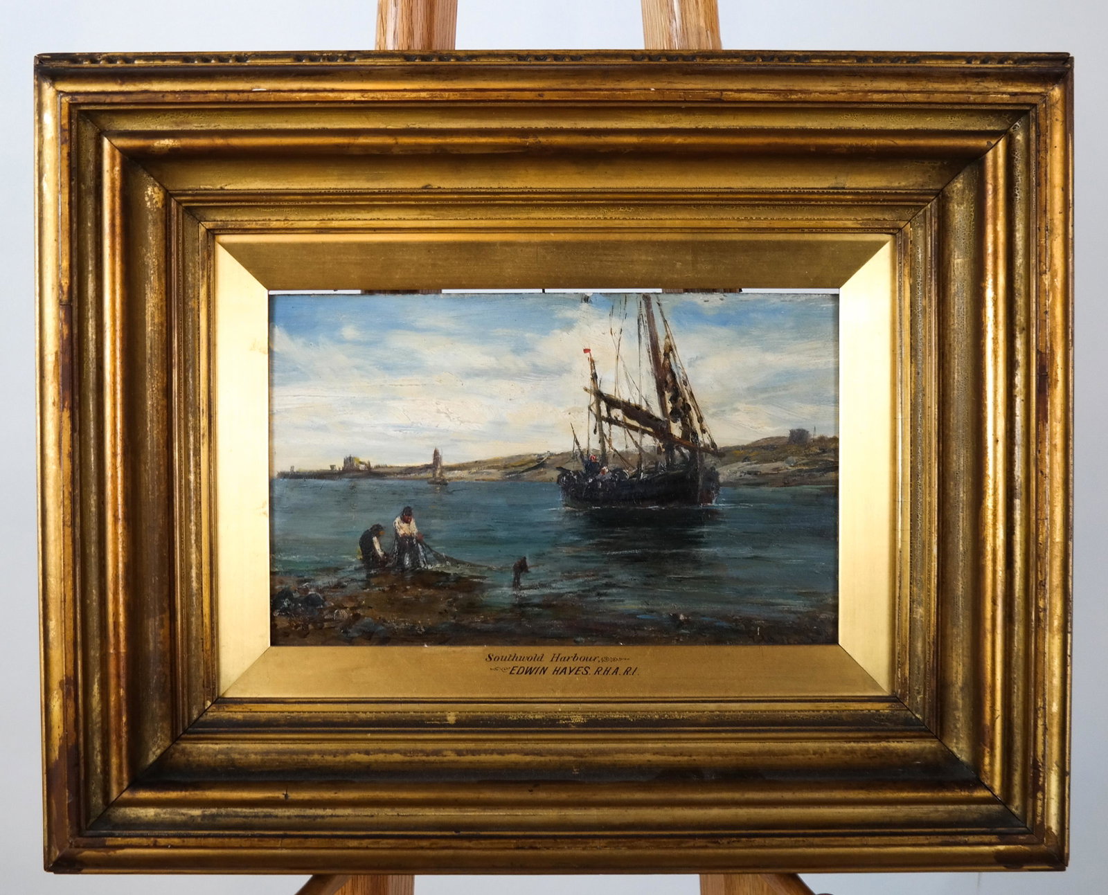 Edwin HAYES: Southwold Harbour - Oil on Board: Scene of boat and fishermen in a harbour by Edwin Hayes, R.H.A. RI, signed lower right. [Art: 7 x 11 1/2 inches; Frame: 15 1/2 x 19 1/2 inches]. In good condition; inner frame loose.