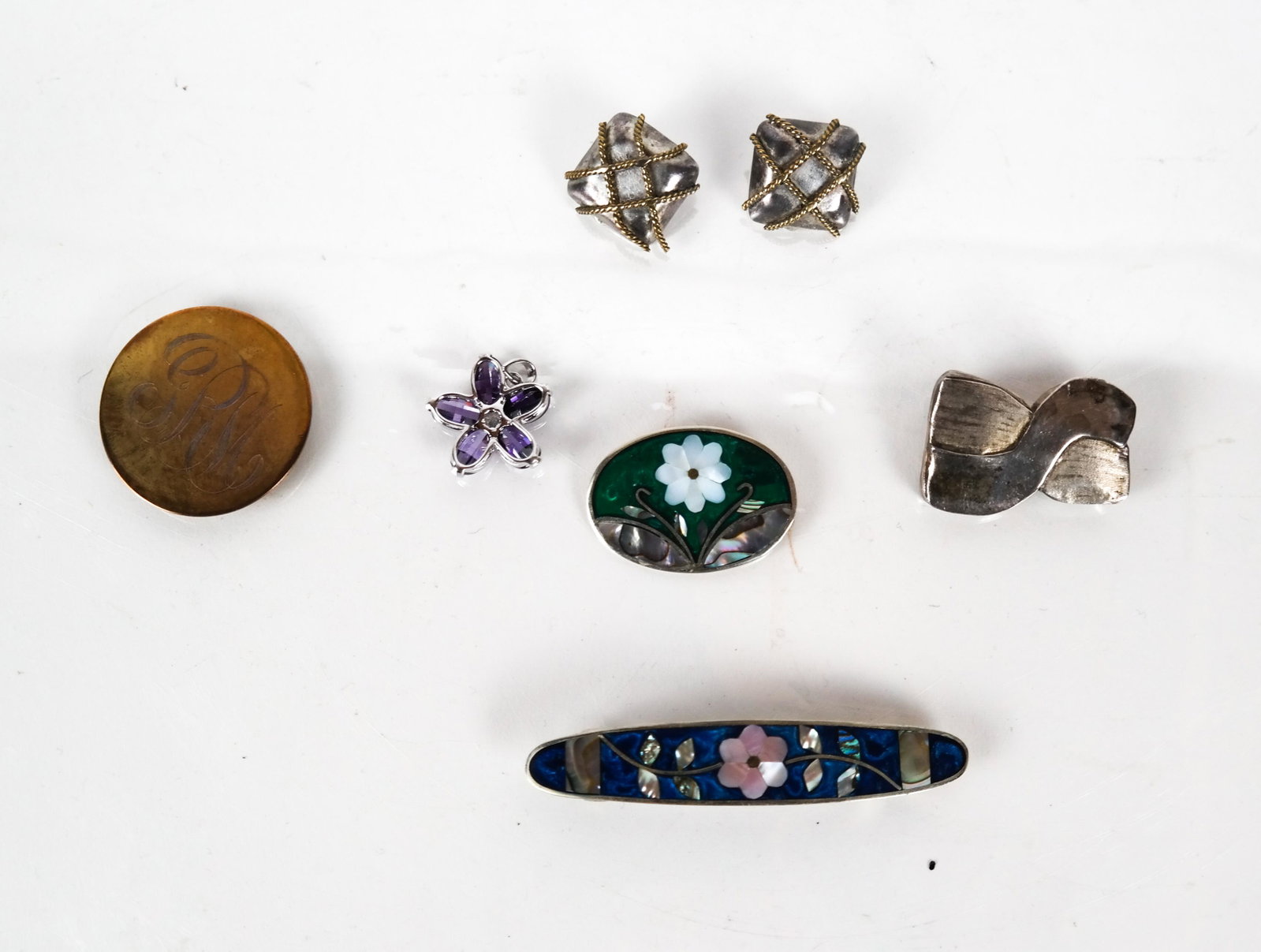 Silver and Assorted Metals, Including Ernest Stein: Modernist sterling pin, pair of earrings TL 41 Ernest Steiner original pin, two silver and enamel pins, and a star pendant. 37 dwt. silver.