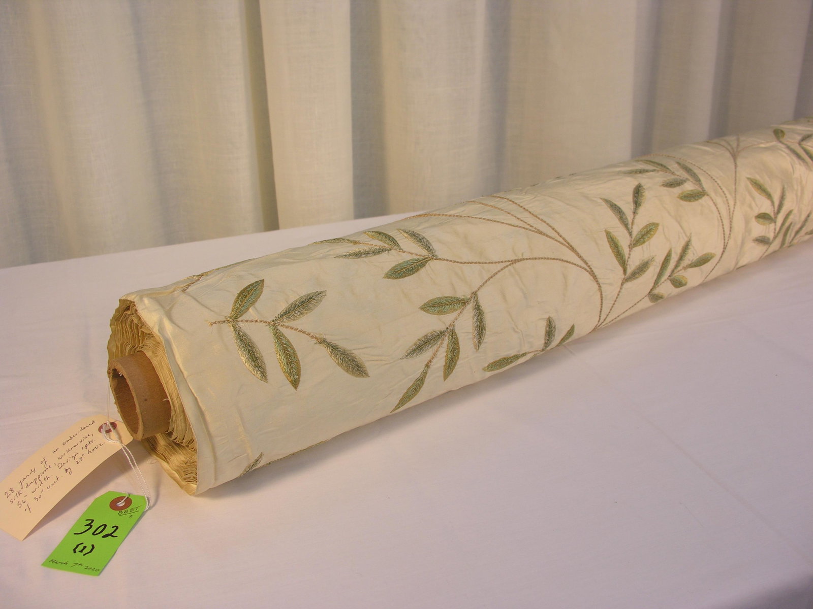 Designer Embroidery on Silk Duppione: 28 yards of exclusive embroidered sil in a delicate willow branch pattern in greens, tan on a creamy beige. The design repeats are 30 inches vertical by 28 inches horizontal across an approx. 56-inch 
