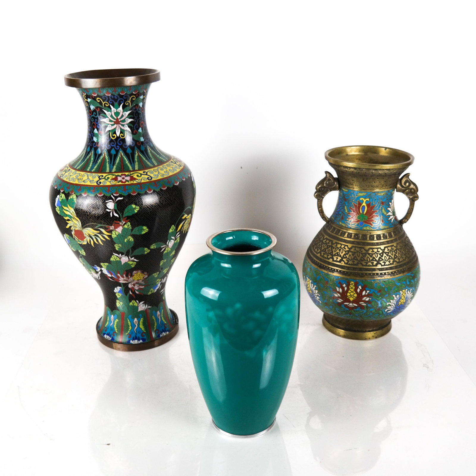 Cloisonne Vase, Amphora, and Ceramic Vase: Bronze and cloisonne vase and amphora, together with a teal ceramic vase (not signed). [Cloisonne vase: 16 1/2 x 8 1/2 (dia) inches; Ceramic vase: 9 3/4 x 5 1/4 inches]. In good condition.