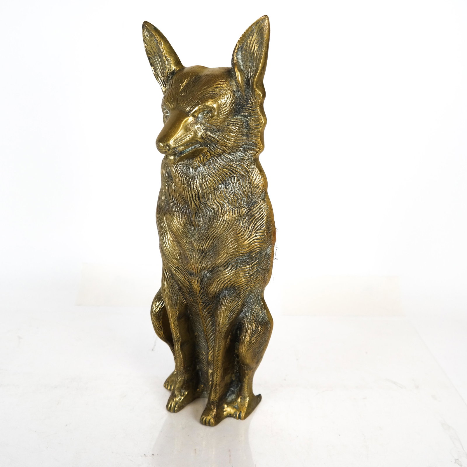 Gilt Bronze German Shepard Door Stop: Gilt bronze German Shepard door stop. [16 1/2 x 5 1/2 x 3 1/2 inches].