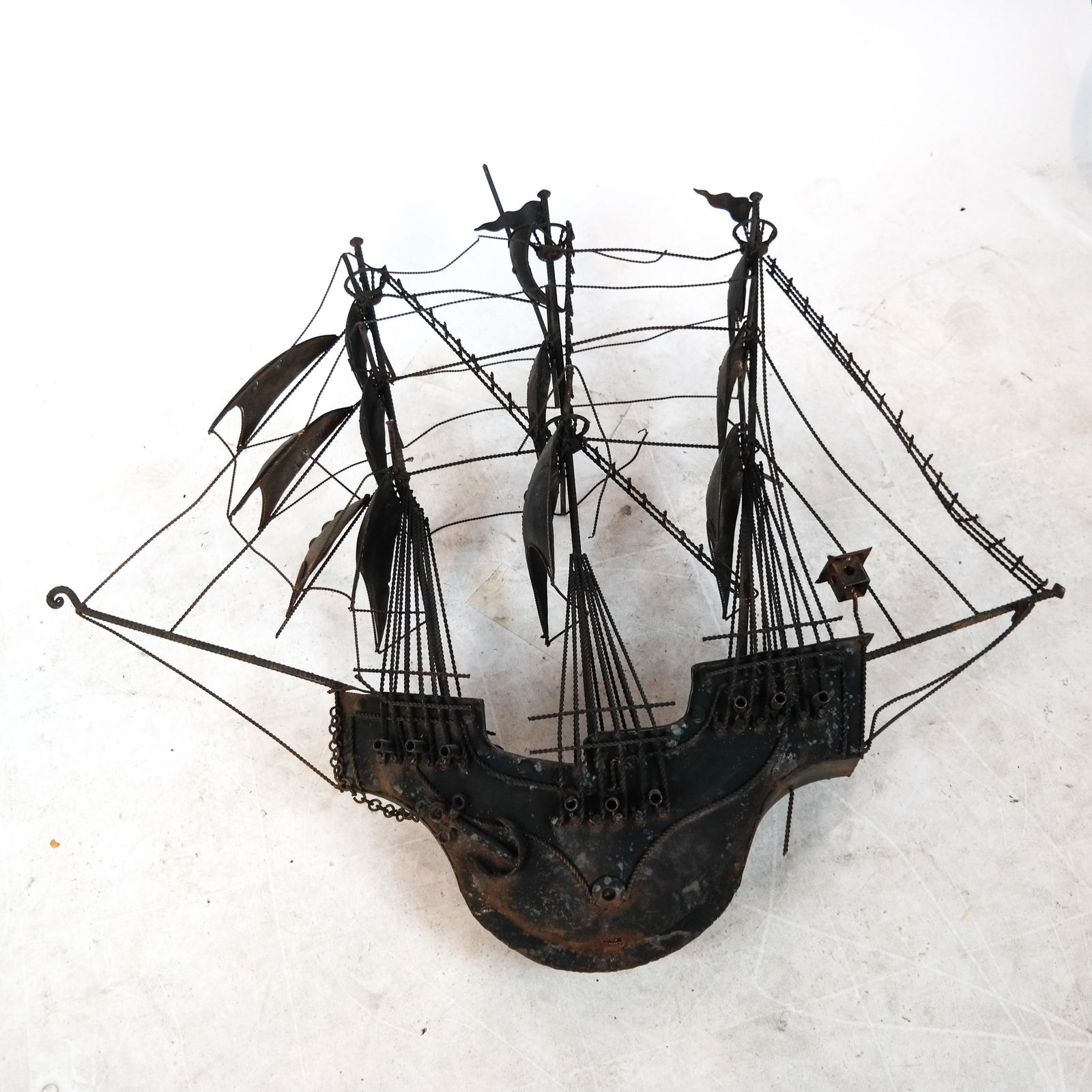 Metal Sculpture of Sailing Ship: Metal sculpture of an early sailing ship. [42 x 47 x 12 inches]. Some elements loose.