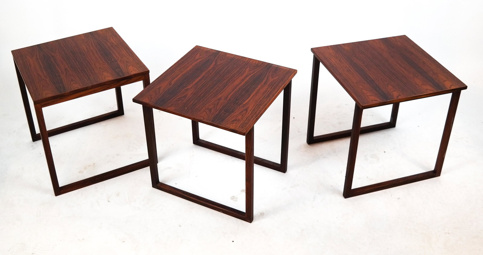 20th C. Modern Nest of Tables: Nest of three Danish Modern-style tables. [16 1/2 x 15 3/4 x 15 3/4 inches]. Some fading at borders.