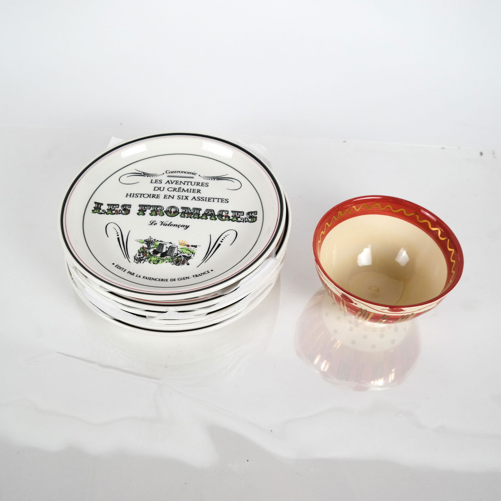 Gien (France) Six Plates, Boxed, "History of Cheese": Gien (France) 6 boxed plates titled (in French) "History of Cheese", together with a "Faune" art pottery bowl, signed illegibly. Both in good condition.