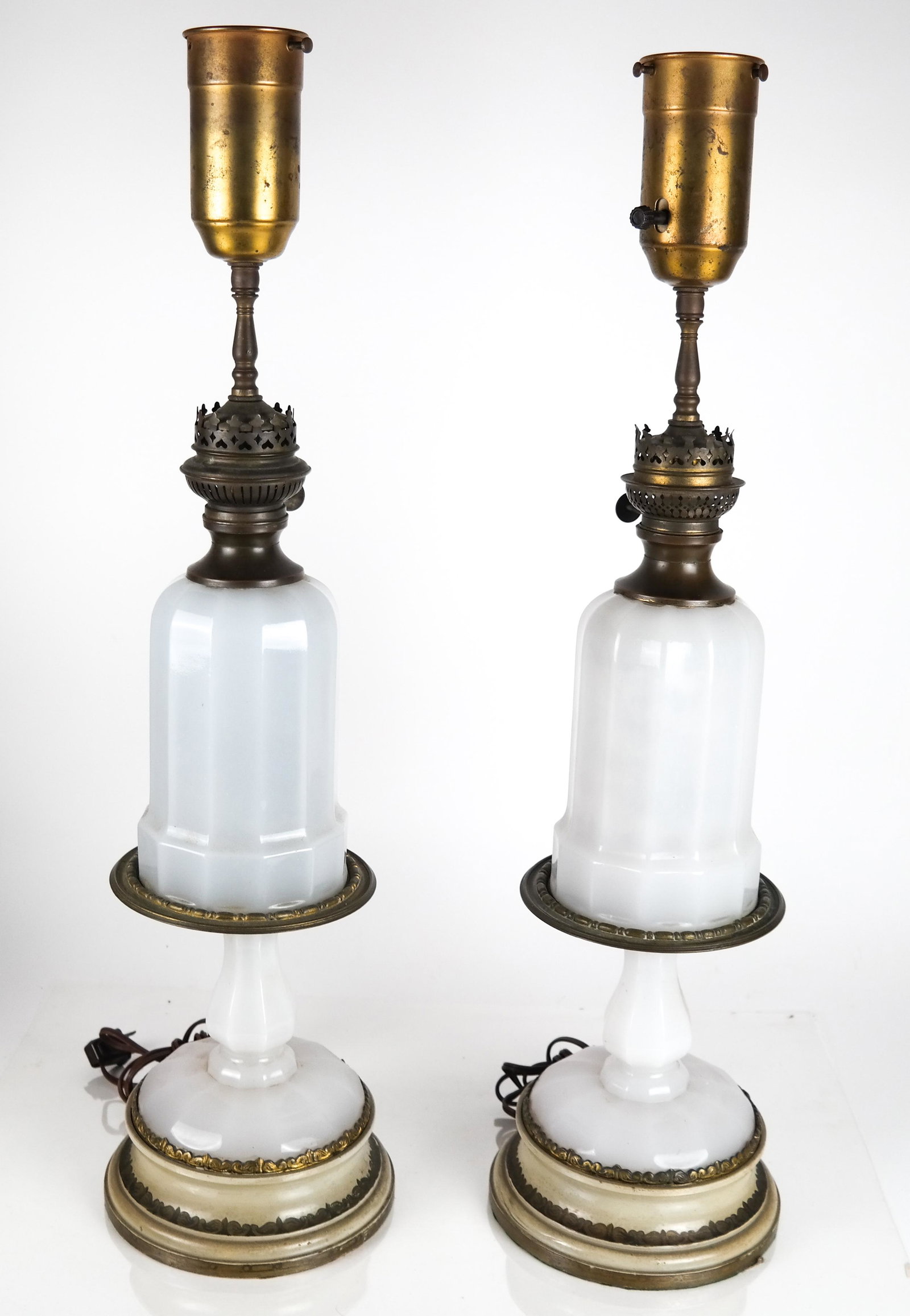 Pair of Opaline Glass Lamps: Pair of lamps converted from gas to electric. [27 1/2 x 7 1/2 (dia)(base) inches]. In overall good condition.