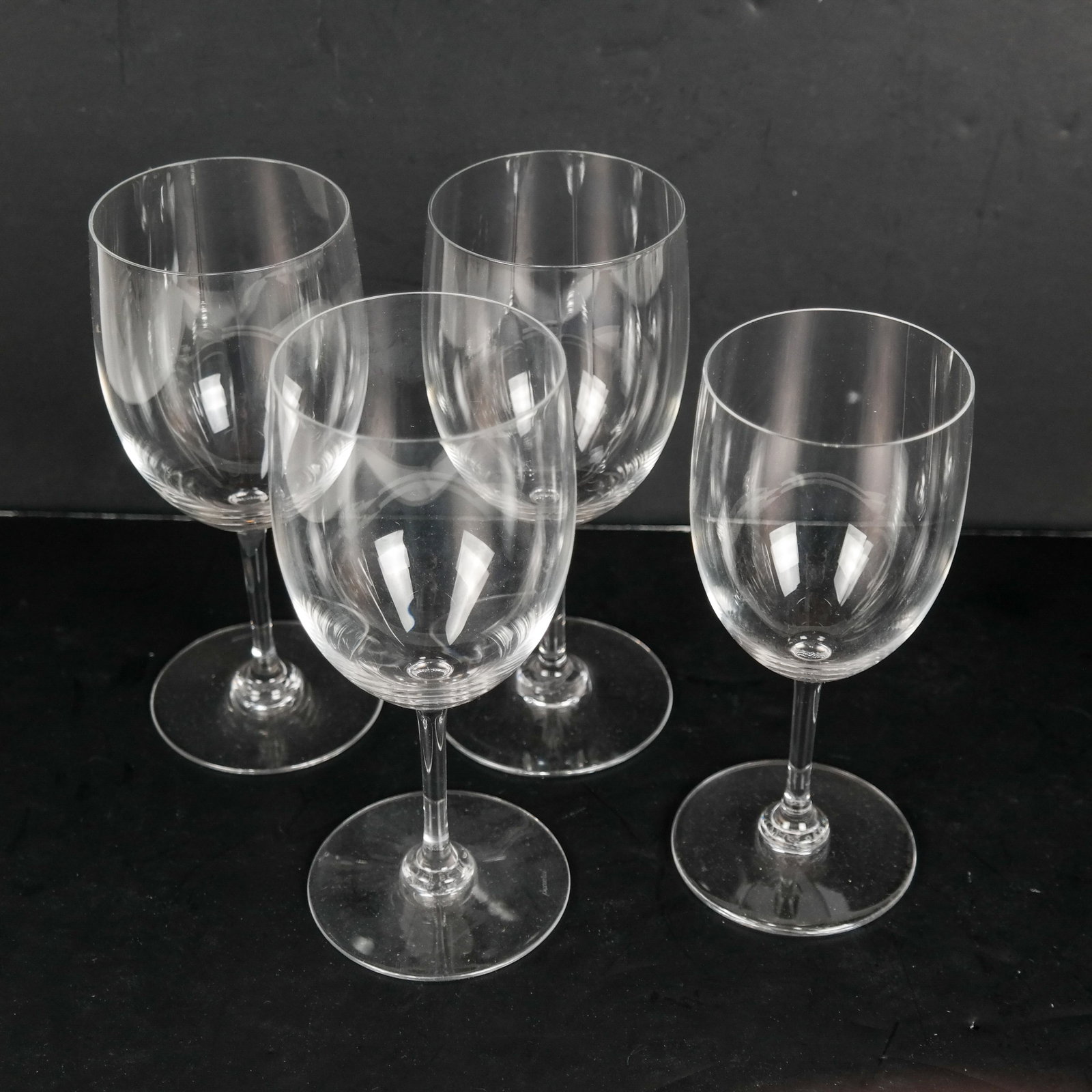 4 BACCARAT Wine Glasses: 4 Baccarat crystal wine glasses. [6 inches high (x2); 6 1/2 inches high (x2)]. In good condition.