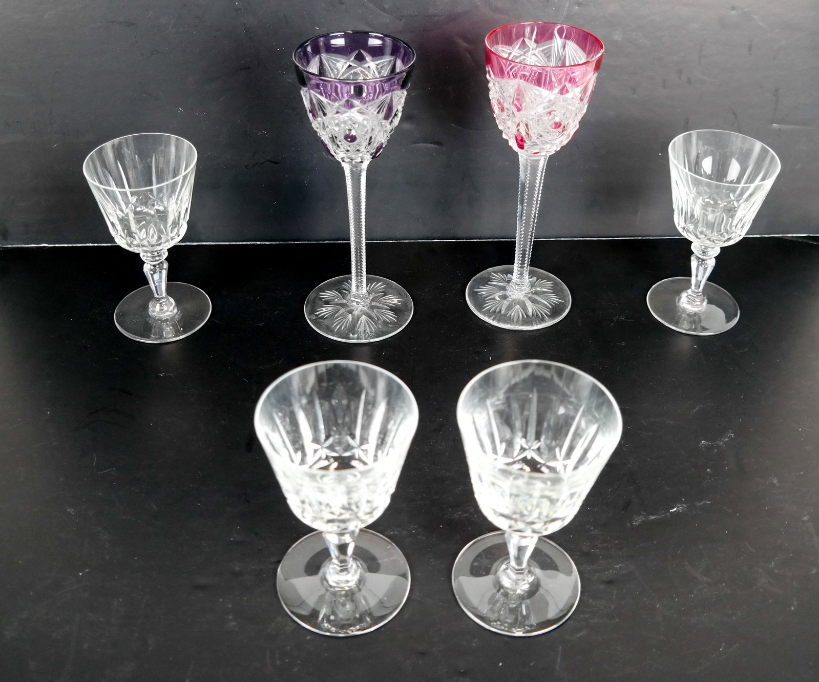 6 BACCARAT Crystal Glasses - 2 Wine, 4 Cordials: 2 Baccarat cutback cordial glasses and 4 crystal wine glasses. In good condition.