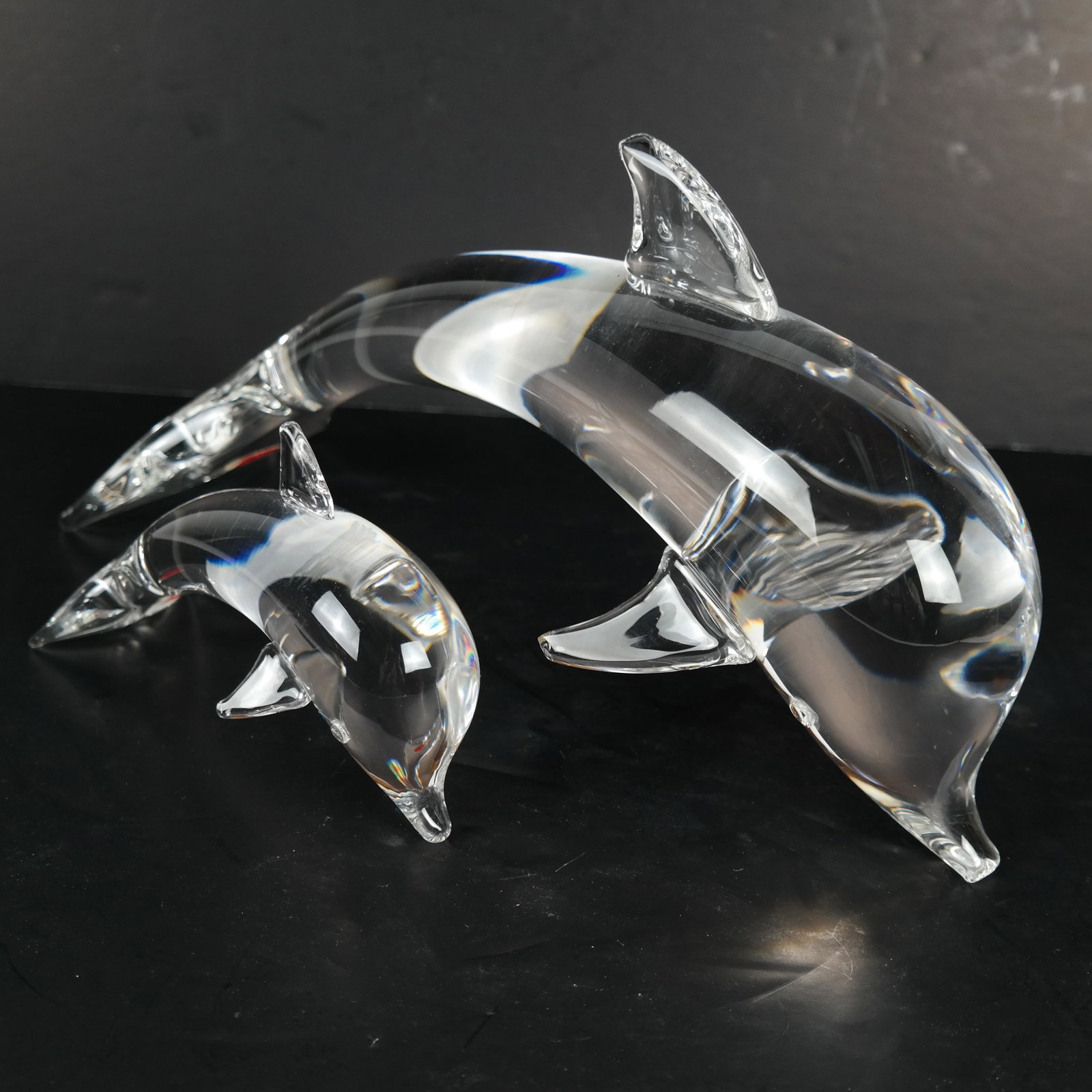 2 Steuben Porpoise, Crystal: 2 Steuben crystal porpoises. [7 x 12 x 4 inches]. In good condition.