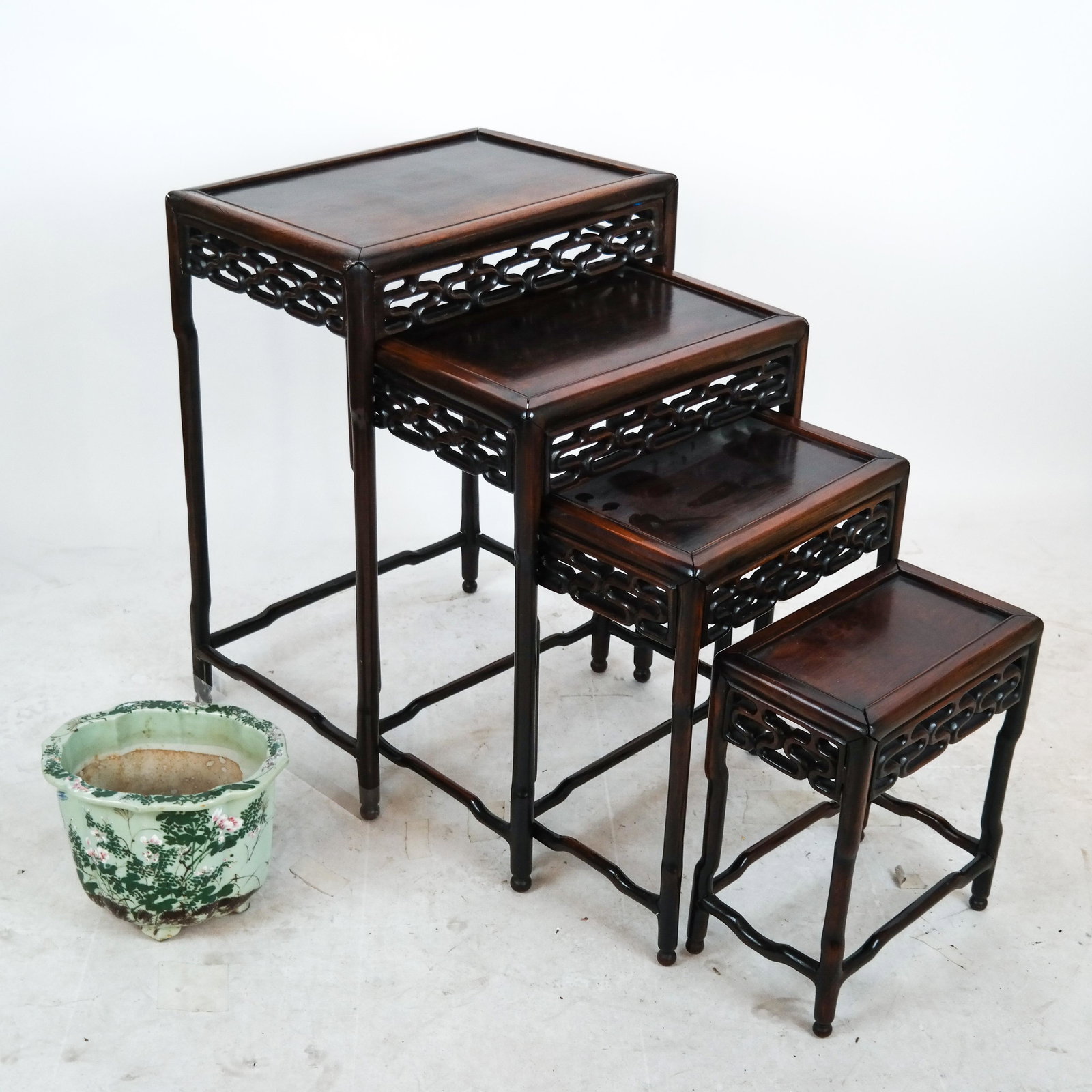 Celedon Floral Planter; Asian Nest of Tables: Celedon floral planter [9 x 11 x 8 1/2 inches] and Asian nest of tables [28 1/2 x 20 1/2 x 15 1/2 inches]. Planter drilled; repaired; nest as is; loose joints; losses.