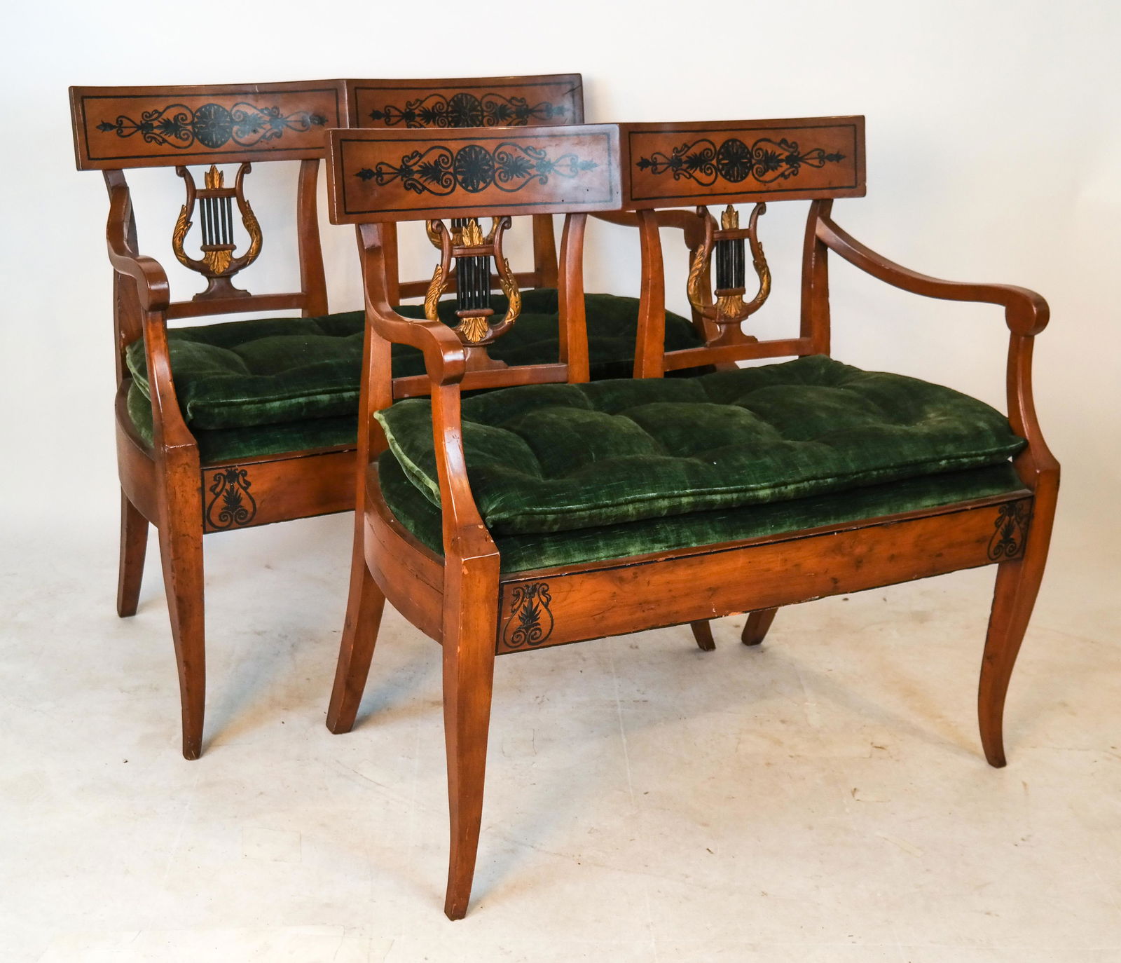 Pair Empire Lyre-Back Settees: Pair of Empire lyre-back settees, with green upholstery. [34 1/2 x 36 1/2 inches; 21 inches to seat]. Some minor repairs; wear.