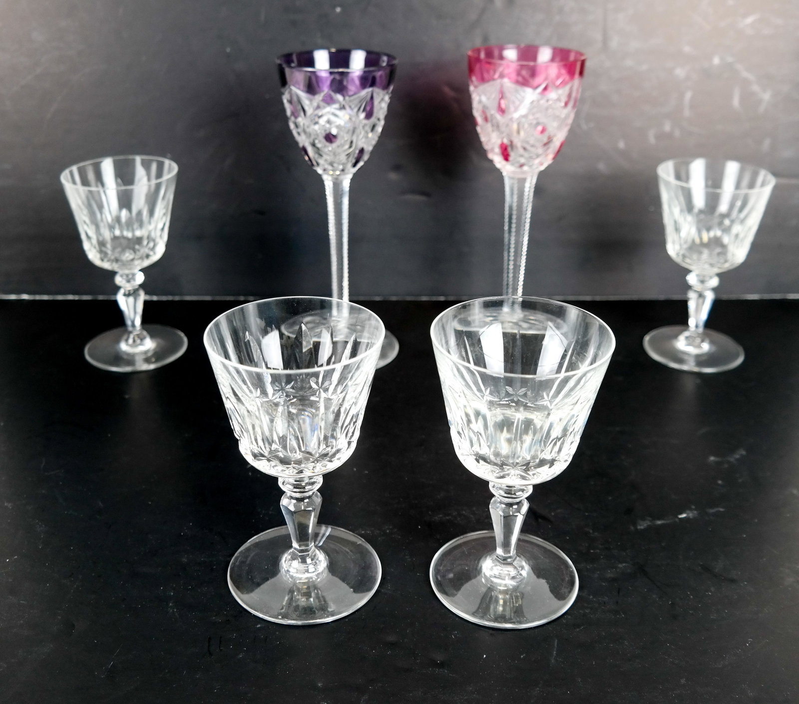 6 BACCARAT Crystal Glasses - 2 Wine, 4 Cordials: 2 Baccarat cutback cordial glasses and 4 crystal wine glasses. In good condition.