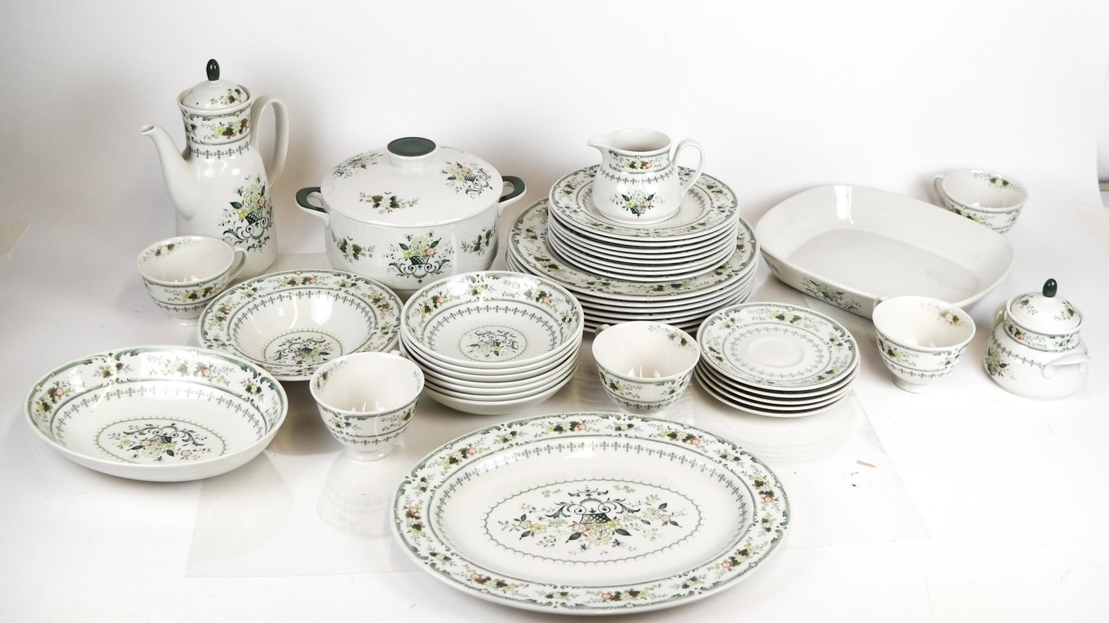 Royal Doulton "Provencal" Dinnerware: Royal Doulton porcelain dinnerware, incomplete: seven dinner plates, eight soup bowls, tureen, charger, teapot, other. [10 1/2 (dia) inches; 9 1/2 x 7 1/2 inches; 6 1/2 x 9 1/2 inches; 13 x 10 inches 