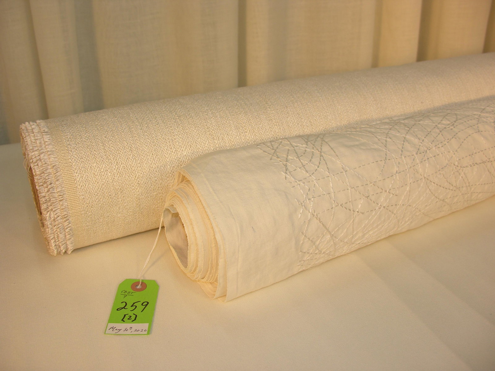 Kravit Embroidery and Complementary Ivory Fabric: 1) 11 1/2 yards of Kravit's white on white linen embroidery, 52 inches wide. Design repeats for the contemporary abstract are 14 1/2 inches vertical by 26 inches horizontal. 2) 13 1/4 yards of a Europ