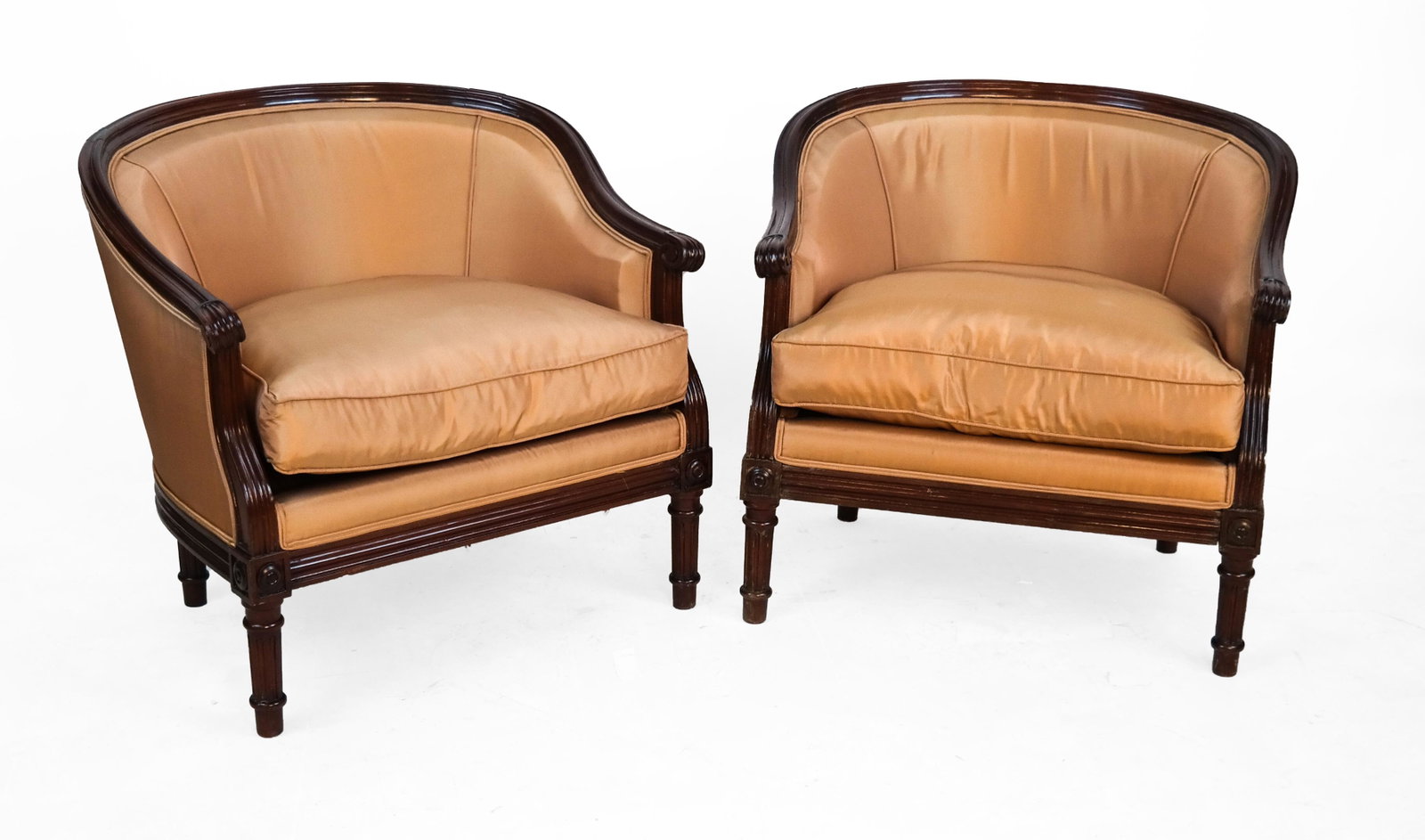 Pair Fruitwood Low Bergeres: Pair of French fruitwood low bergeres, with tan upholstery. [24 x 24 1/2 x 20 inches].