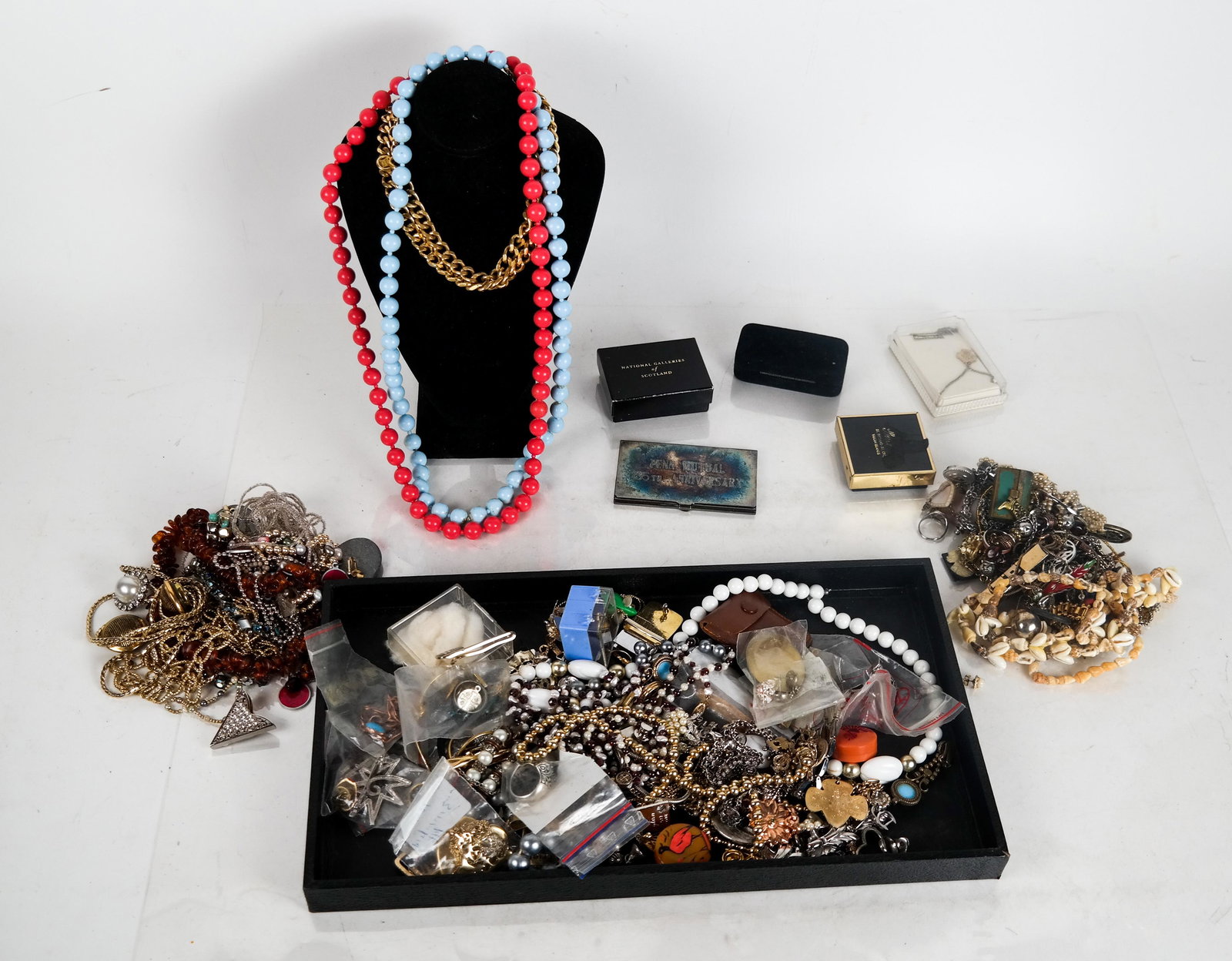Lot of Costume Jewelry: Costume jewelry lot includes earrings, pins, chains, necklaces, bracelets and beads, by Cousin Claudine, Thelma Deutsch, Sorelli, and more.