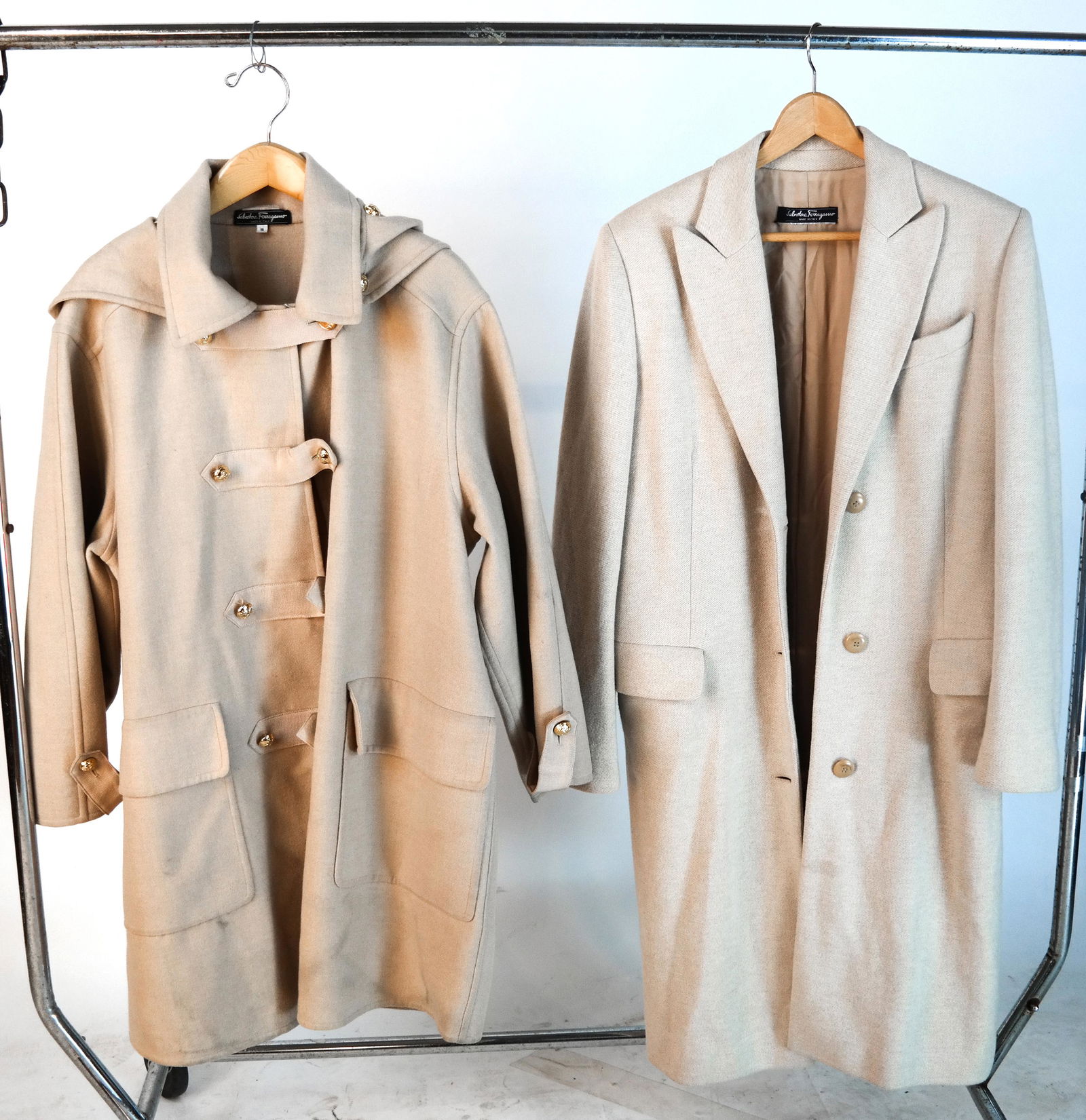 2 Salvatore Ferragamo Off-White Wool Ladies Coats: Duffel coat, size S, with detachable hood, and an overcoat, size S. In good used condition; minor soiling.