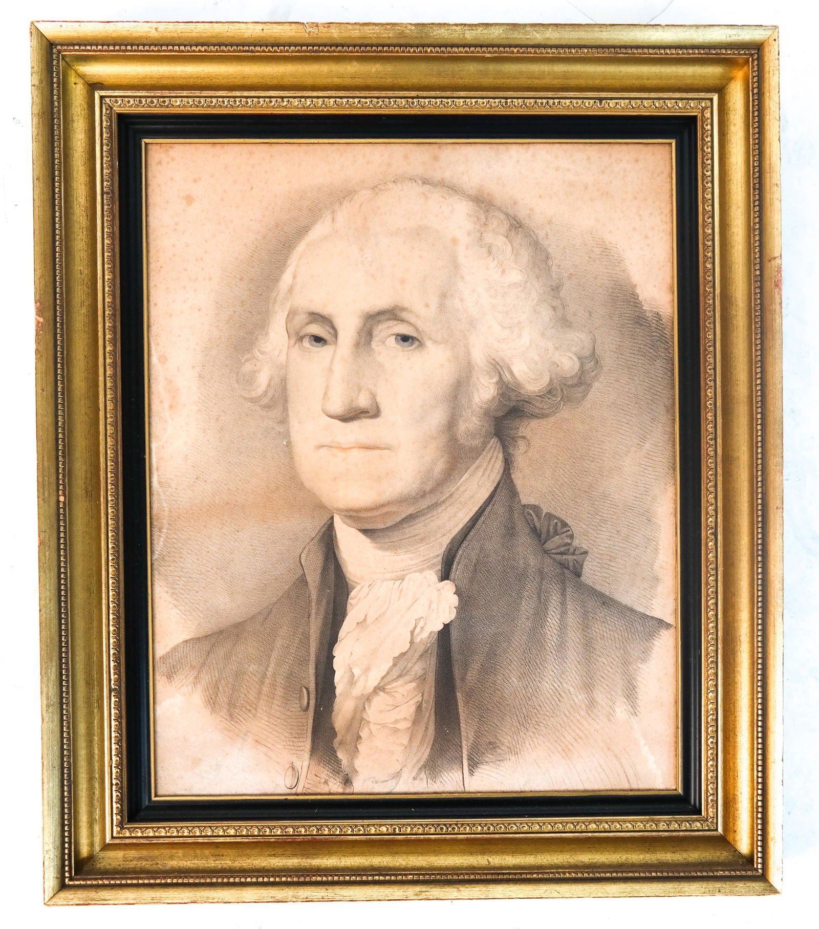 Portrait of George Washington: An engraved portrait of George Washington, after the famous portrait by Gilbert Stuart. In gilt frame. [Art: 21 x 17 3/8 inches; Frame: 24 3/8 x 20 1/2 inches]. Foxing; water stain far left; pinhole t