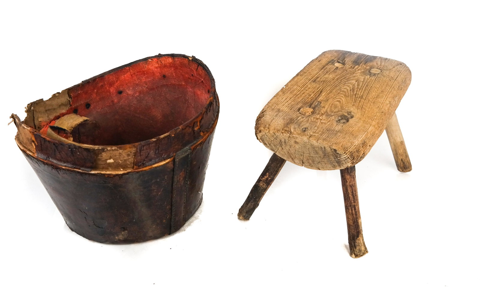 Leather Pail and Bench: Leather pail and bench. [Pail: 9 1/2 x 13 x 11 inches; Bench: 8 1/2 x 12 x 7 inches]. Pail in poor condition; one leg replaced on bench.
