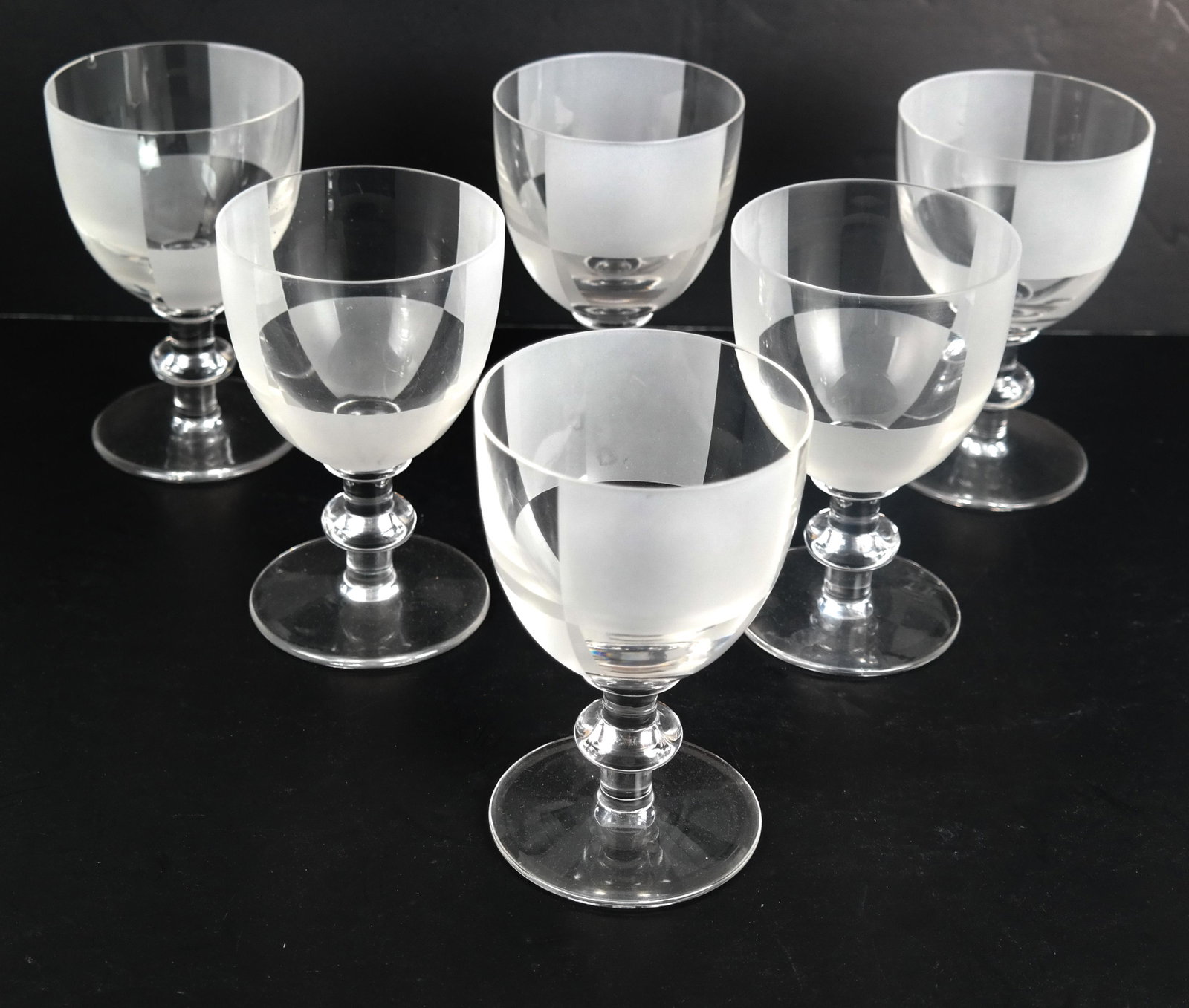 6 Hermes, Paris, Crystal Wine Stems: Six Hermes, Paris, crystal wine stems. [6 x 3 1/2 (dia) inches]. Chip on rim.