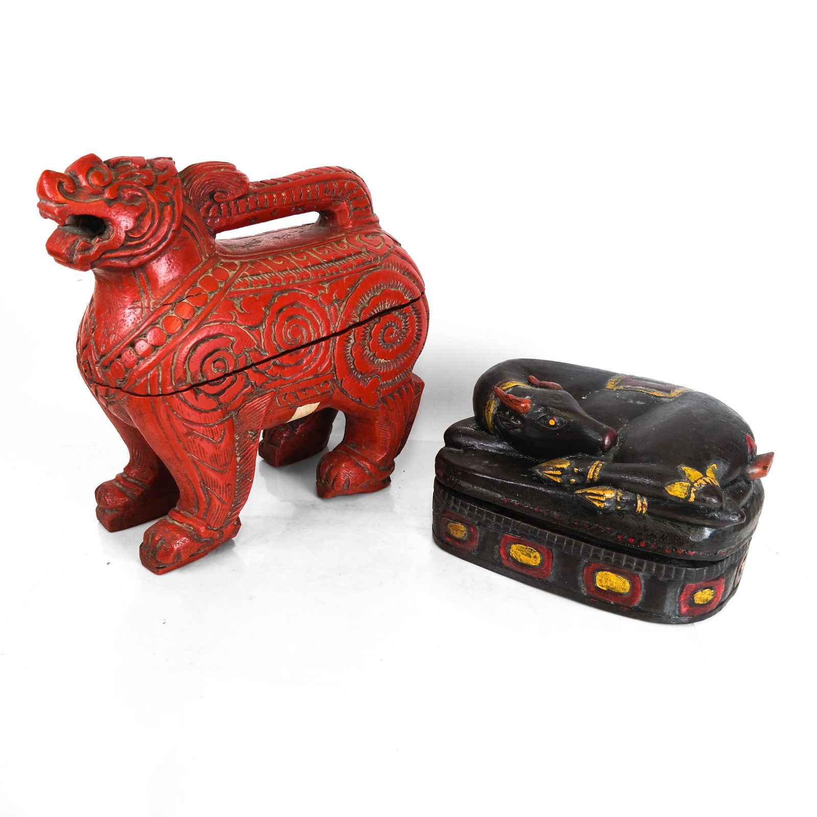 Two Chinese Animal Boxes: Two covered boxes, one with a red foo dog, the other brown with a recumbent horse. [15 1/4 x 6 x 14 3/4 inches; 8 x 8 x 13 inches]. Both in good condition.