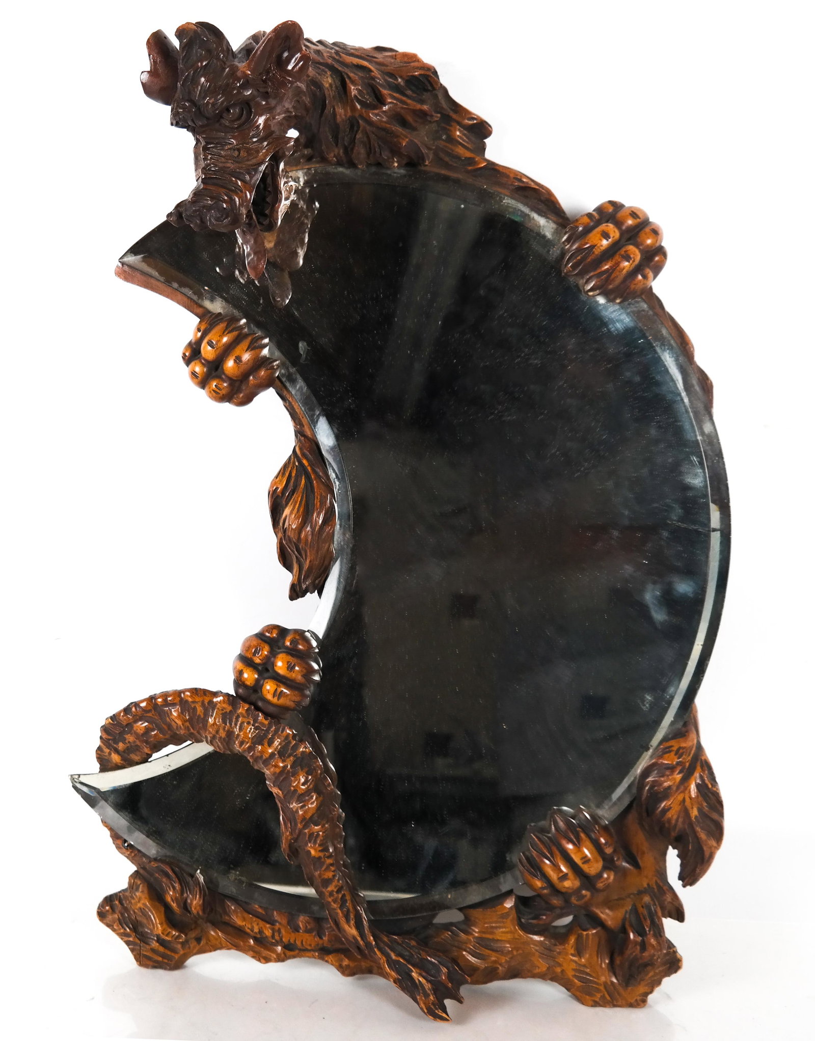 Dragon-Form Beveled Mirror: Crescent-shaped beveled mirror mounted in a dragon-form sculpture. [26 x 17 x 7 inches]. Minor wear; minor edge chips.