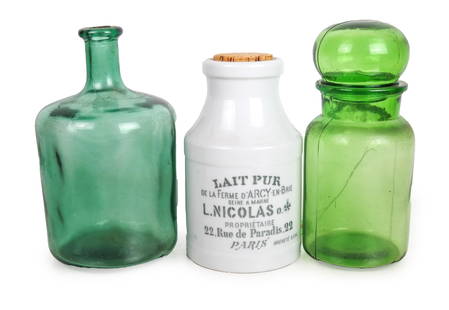 Two Glass, One Ceramic Decanters: Two green glass decanters, one with a stopper and a white ceramic decanter with a cork stopper, L. Nicolas, Paris. All in good condition.