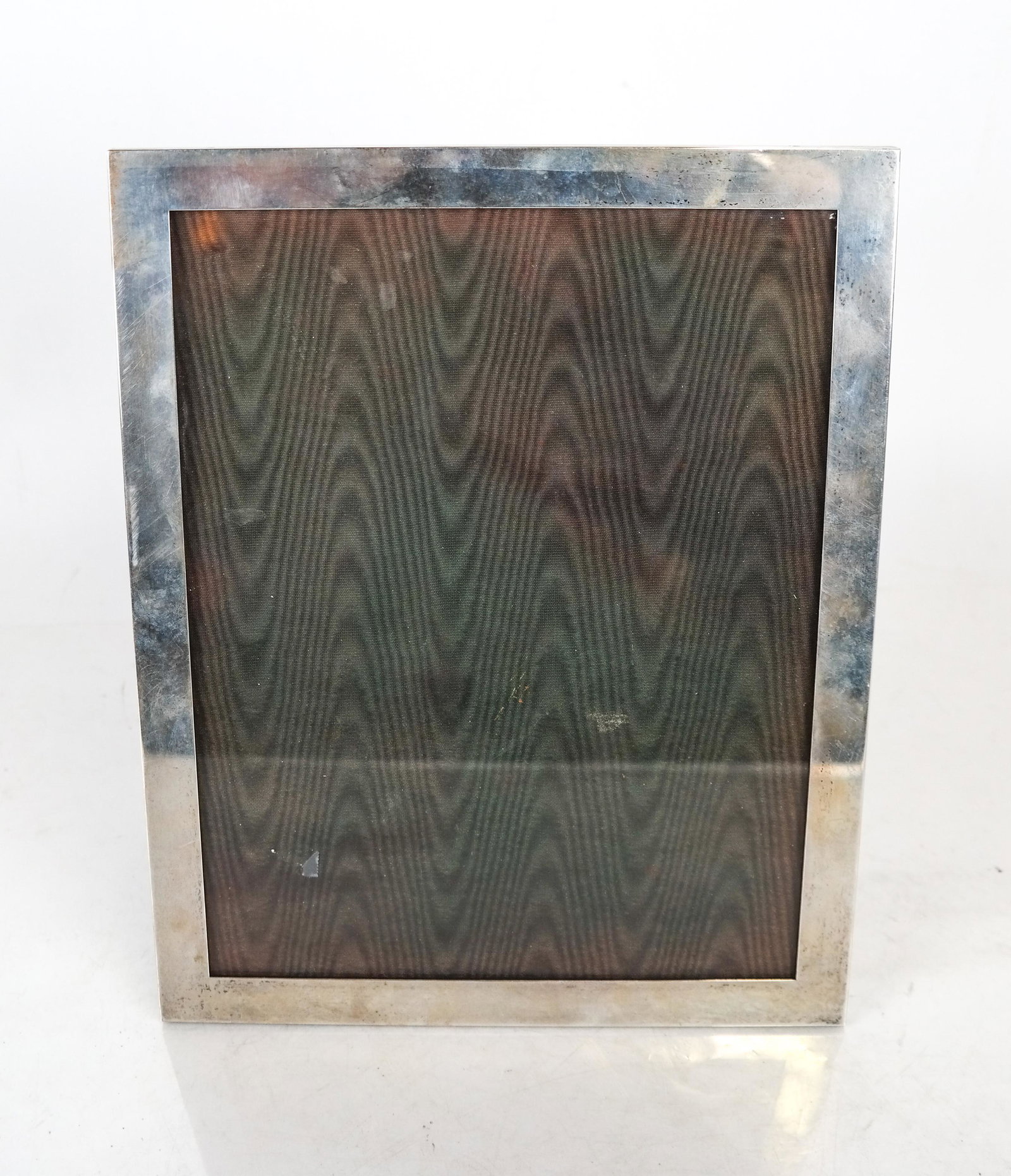 Webb Sterling Silver Photo Frame: Webb sterling silver photo frame. [10 x 8 inches]. Taped to hold back.