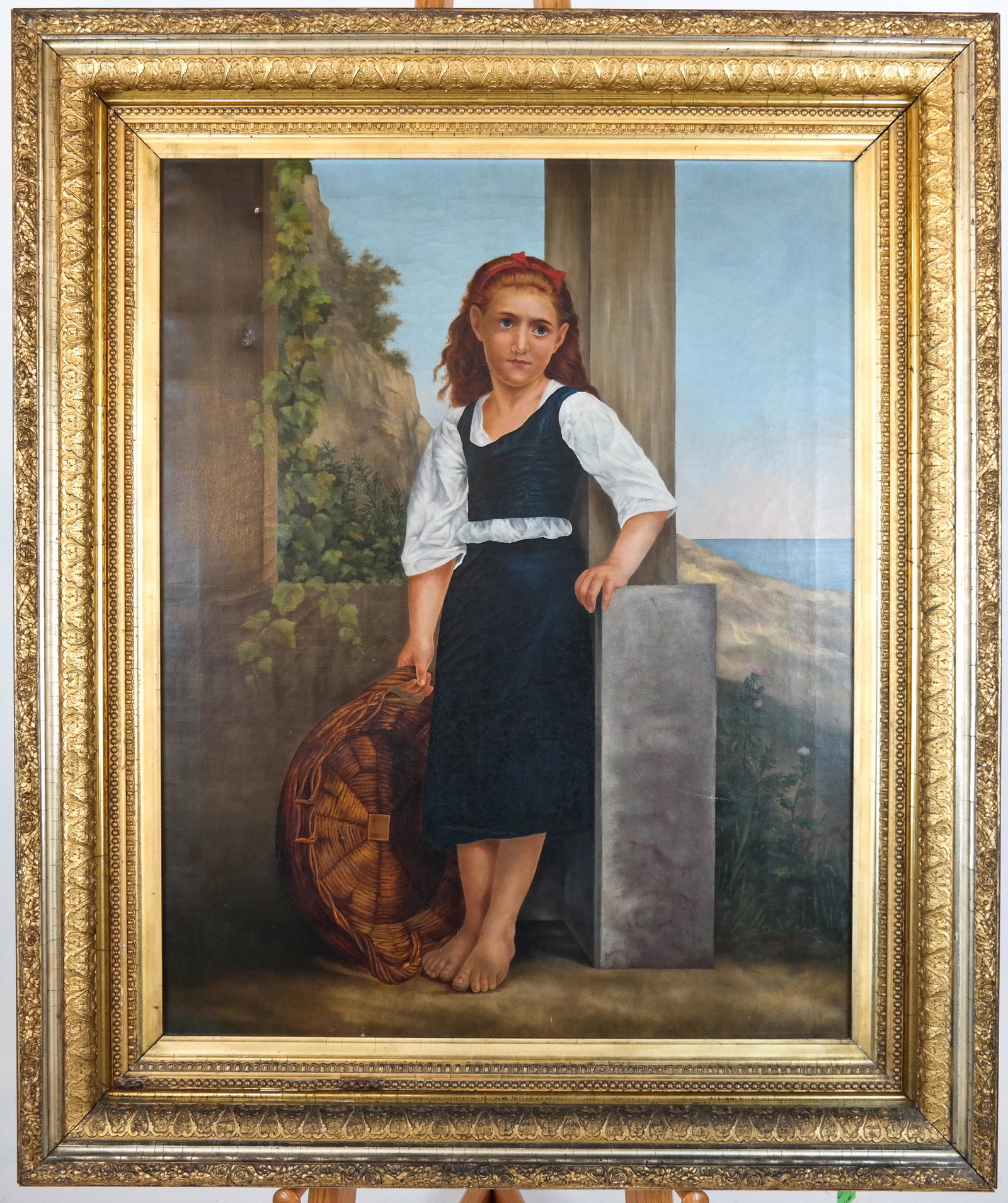 Continental School: Young Girl with Basket - O/C: 19th century oil on canvas painting of a young girl with a basket, against a pastoral landscape backdrop, not signed, in an ornate gilt frame. [Art: 34 x 27 inches; Frame: 44 x 36 1/2 inches]. Craquel