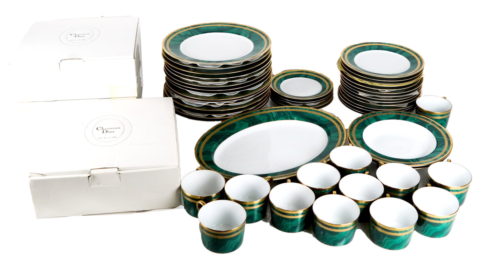 Christian DIOR "Gaudron Malachite" Partial Dinner: Partial Dior "Gaudron Malachite" porcelain dinner service, including 15 dinner plates (11"), 14 salad plates (8"), a 14" oval vegetable dish, 12 cups and 5 saucers (5 1/2"). __ pieces. In good conditi