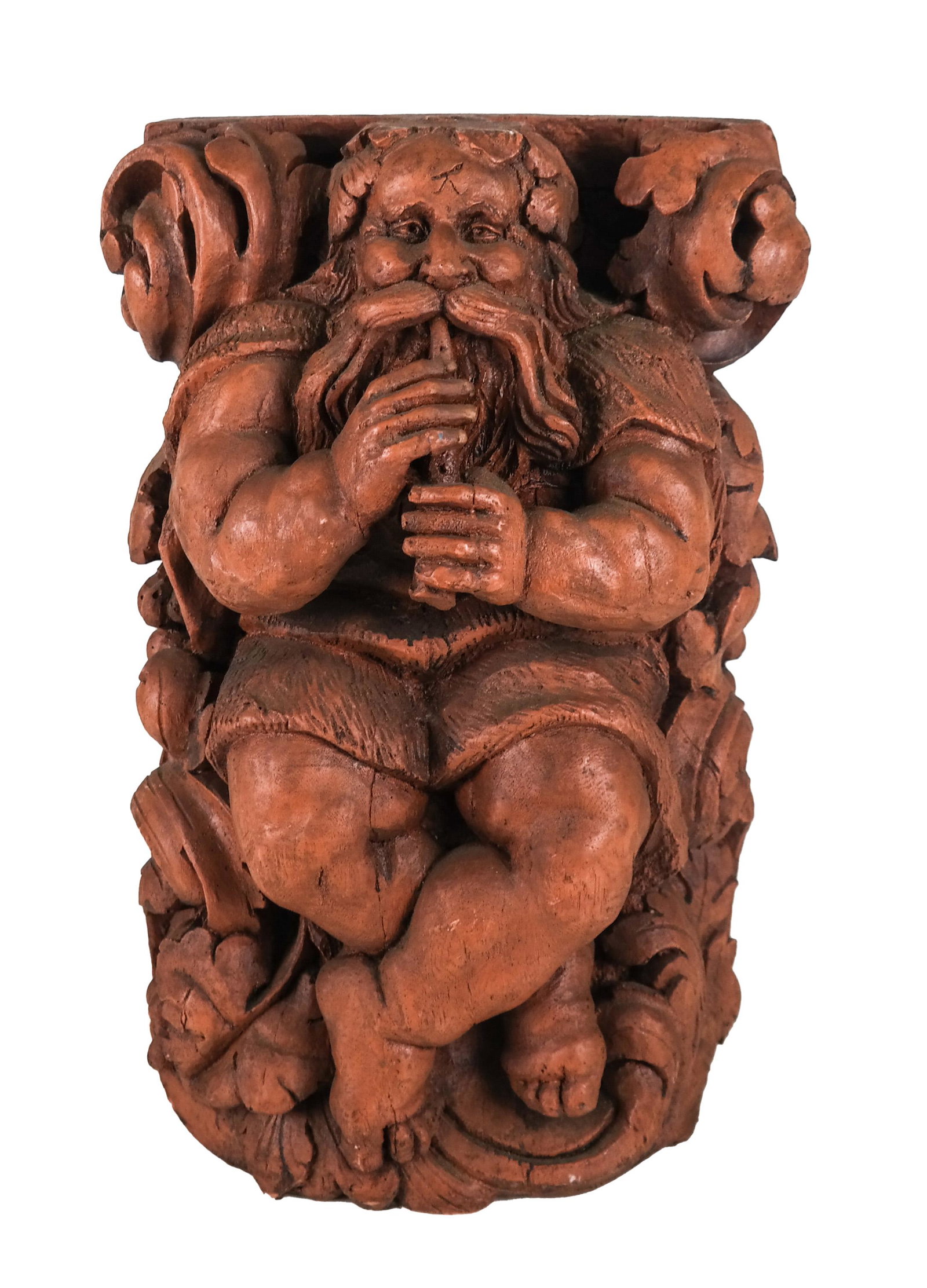 Carved Flautist: Heavy cast resin figure of a man playing the flute in Medieval clothes. [15 x 10 x 7 inches].