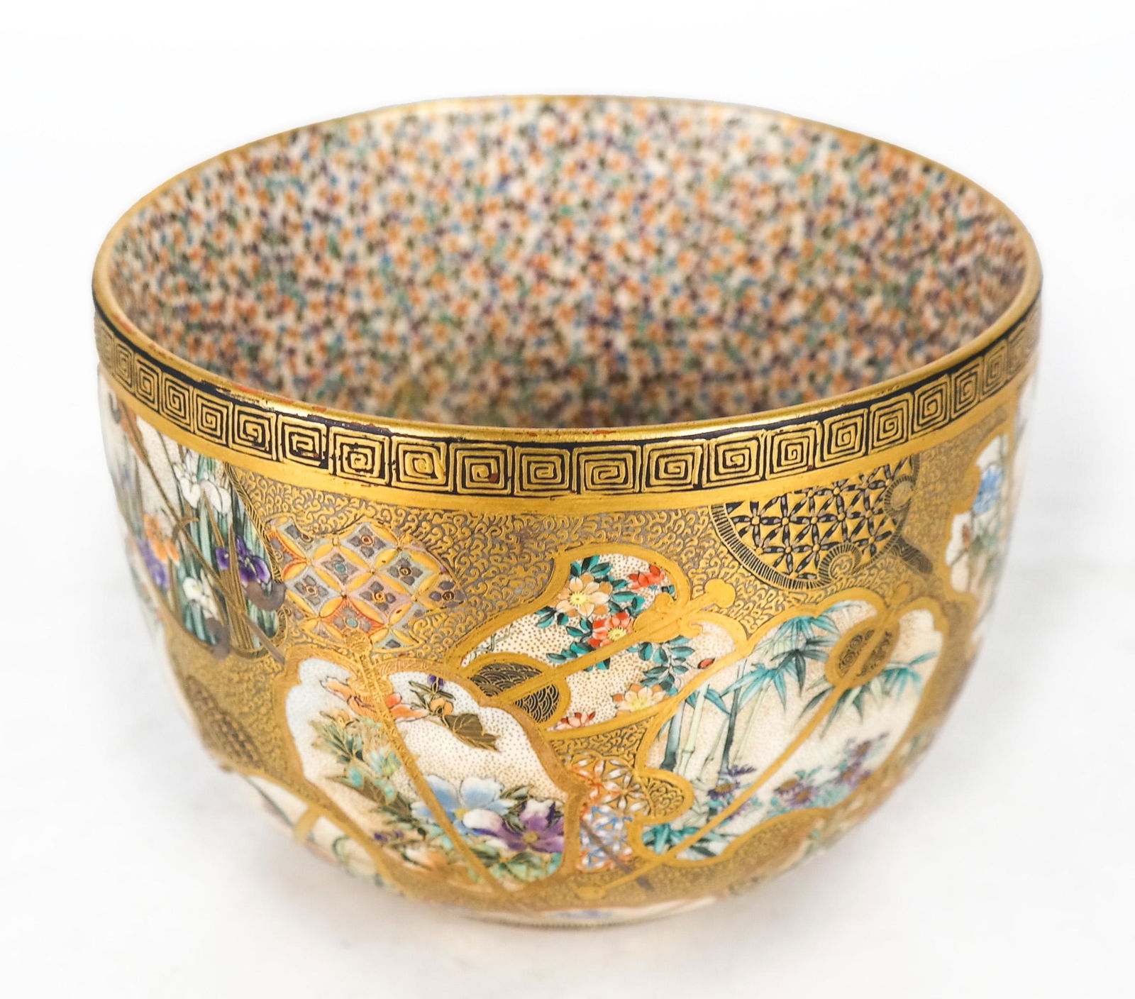 Japanese Satsuma Deep Bowl: A Japanese Satsuma deep bowl with Thousand Butterflies inner bowl design. [4 x 5 1/4 (dia) inches]. In good condition.