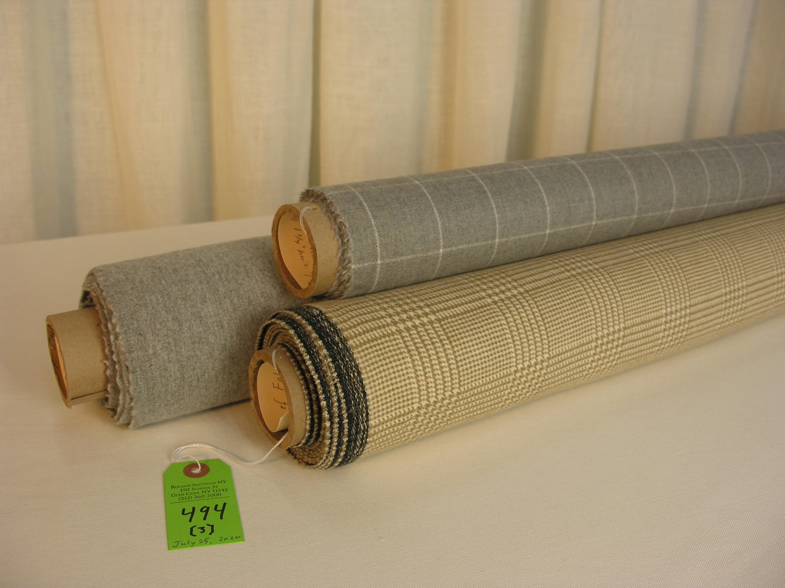 Folia and Loro Piana Fabrics: 1) 6 yards of Folia's "Hathaway Glen Plaid" in camel and cream, with a 60" width. The design repeats are 3 1/4" vertical by 3" horizontal. The decated worsted wool creates a pleasing hand. Great for u