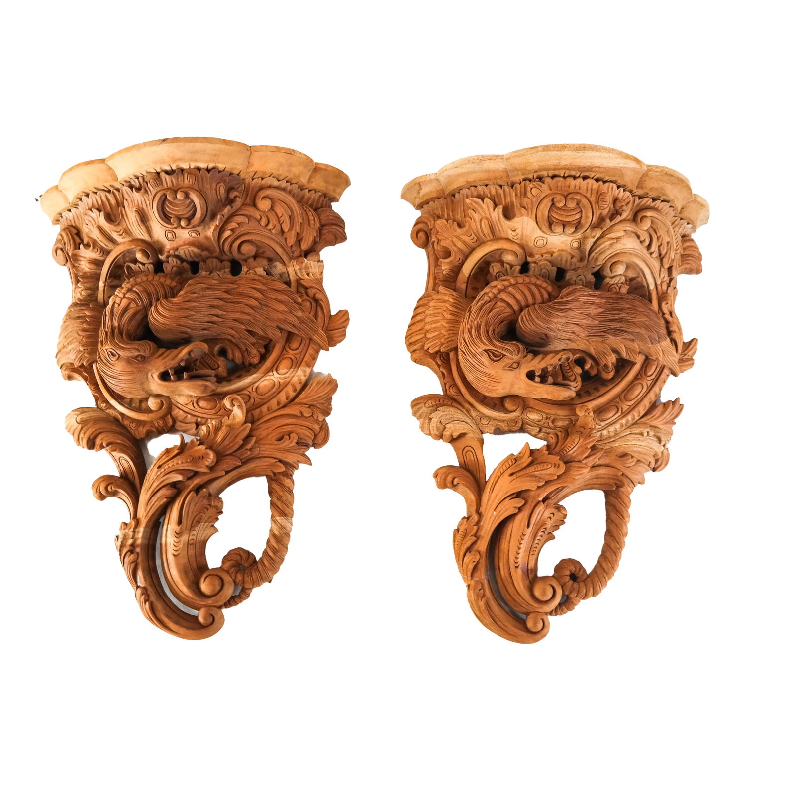 Pair of Wall Brackets: Pair of unfinished, carved, solid mahogany French Regence-style dragon wall brackets. [22 x 15 x 7 inches].