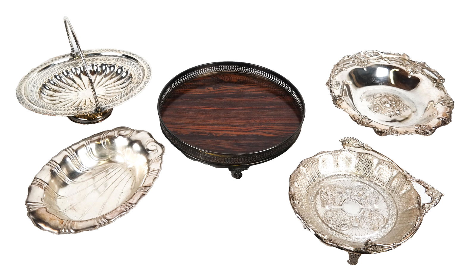 Lot of 5 Silver Plate Table Articles: Lot includes three swing-handled, footed baskets [largest 3 x 11 (dia) inches (not including handle)], a Neptune deep shell oval bowl [12 x 8 1/2 inches] and a footed bar tray with reticulated gallery