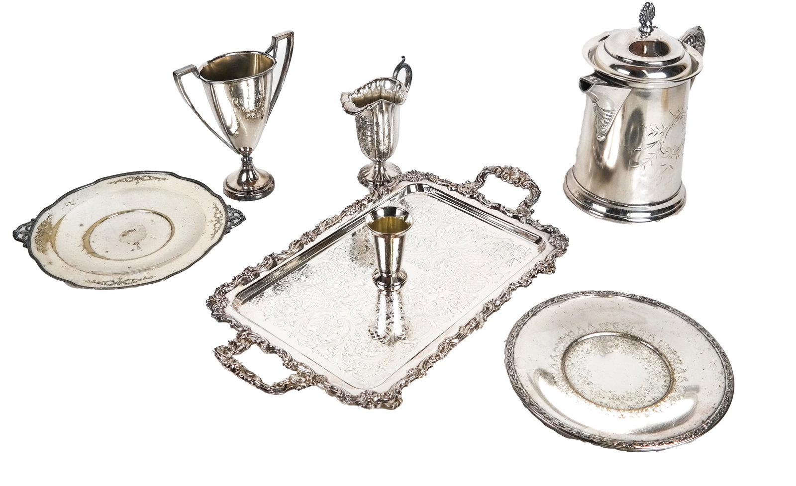 Lot of 7 Silver Plate Table Articles: Lot includes a large coffee pot, a two-handled tray, 2 cups, a sauce pourer and two plates. [Largest (coffee pot): 9 1/2 x 11 1/2 x 6 1/2 inches; Tray: 20 1/2 x 11 1/2 inches].