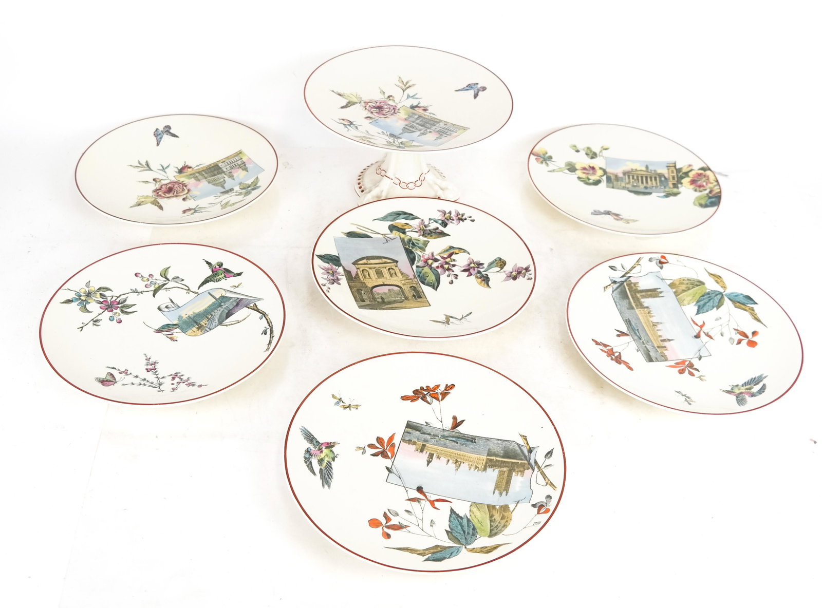 Powell Bishop Stoner Dinnerware: An English porcelain tazza and six salad plates/cabinet plates. All matching. [Tazza: 5 x 9 (dia) inches; Plates: 9 (dia) inches].