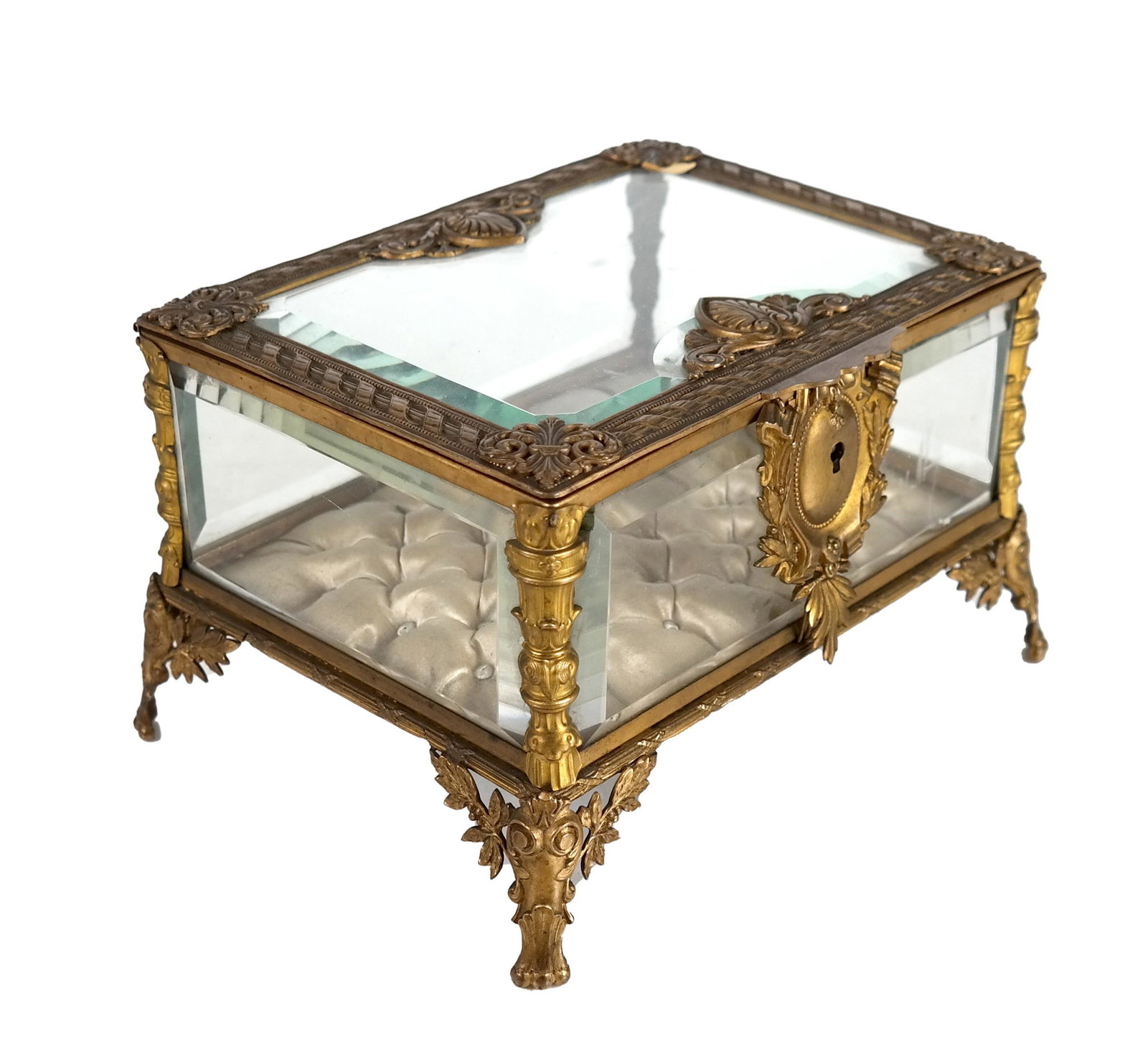 French Brass and Beveled Glass Jewelry Box: French brass and beveled glass jewelry box with tufted silk lining. [5 1/8 x 8 5/8 x 6 1/2 inches]. In good condition.