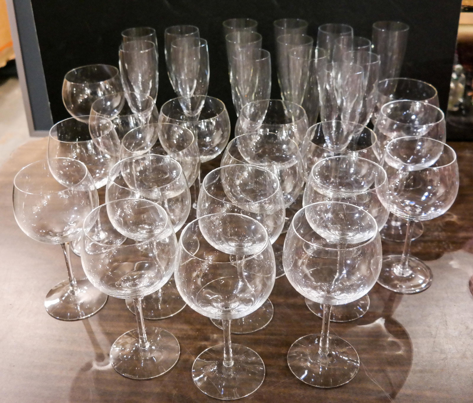 Lot of 35 Pieces of Stemware: Lot of stemware includes 11 Tiffany wine glasses. [Tallest: 9 3/8 inches high].