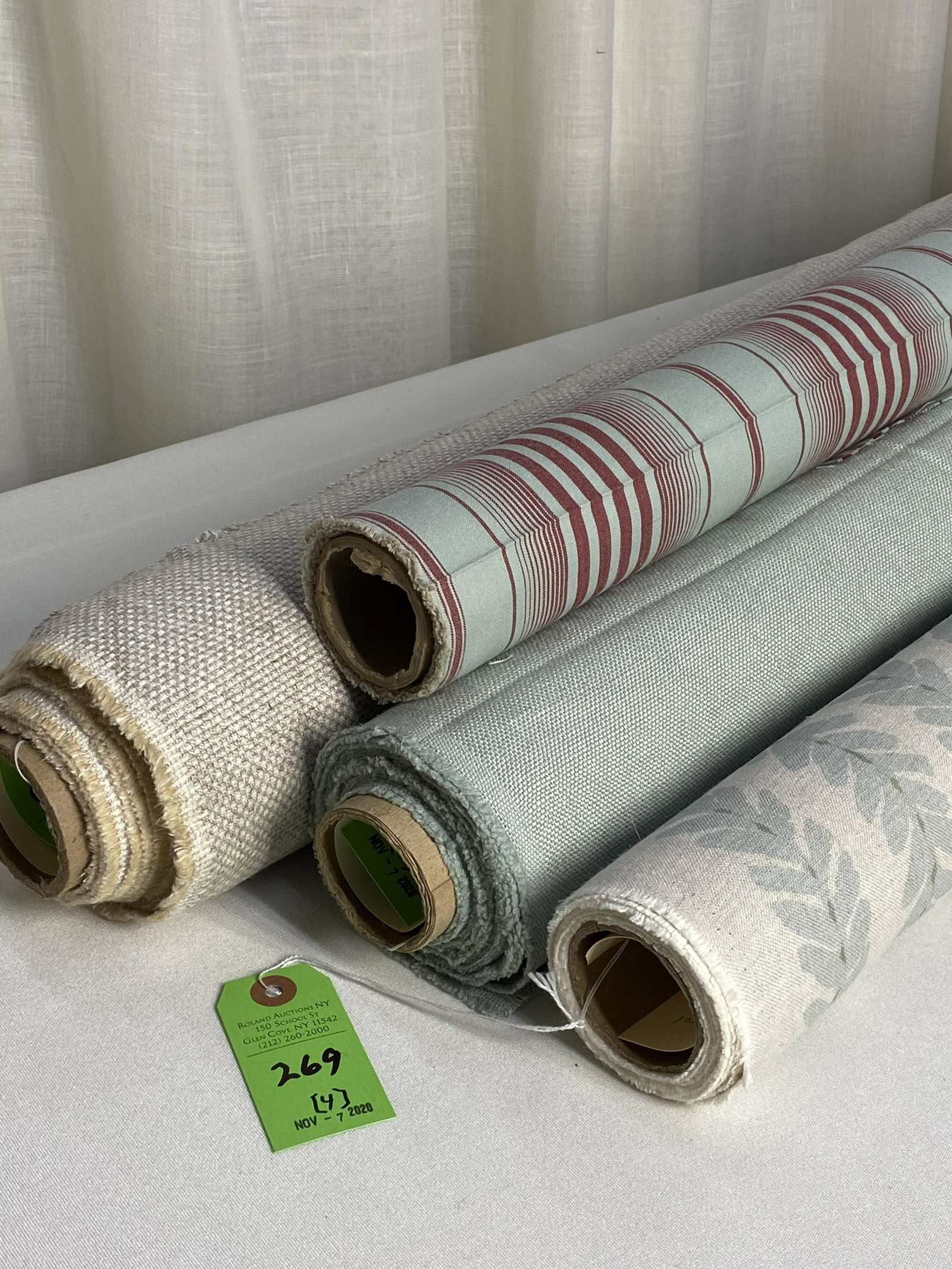 Schumacher, Cowtan & Tout, K. Ireland and Romo Fab: 1) 4 3/4 yards of Schumacher's English linen laurel striped print "Woodperry", in aqua and sage on natural, 54 inches wide. Design repeats of 15 inches vertical by 8 1/2 inches horizontal. 2) 5 yards 