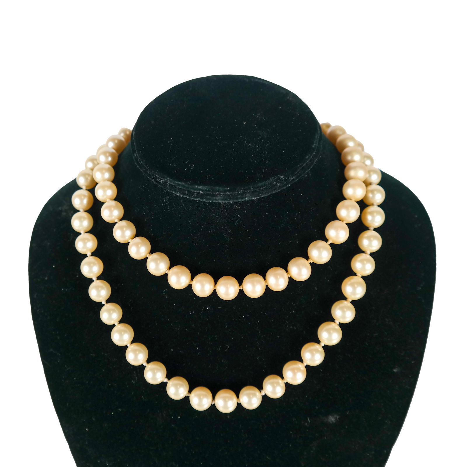 Les Bernard Faux Pearl and Gold Tone Necklace: Faux pearls with gold tone clasp, marked "Les Bernard". [32 inches long]. Pearls with wear.