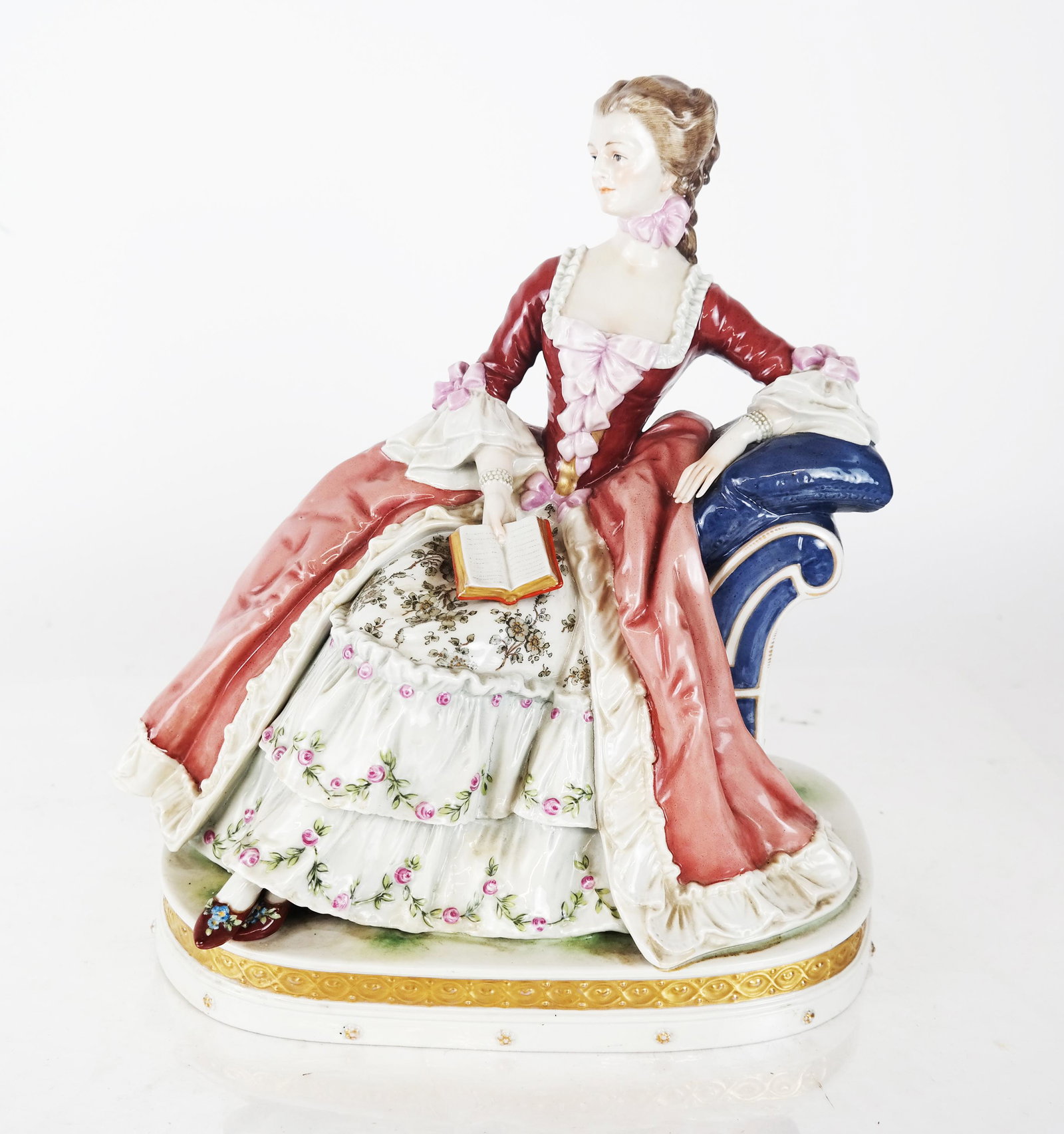 Sevres, France - Woman - Sculpture: Porcelain decorated reclining woman sculpture, France. [11 1/2" H x 10 1/2" W x 7" D]. In good condition.