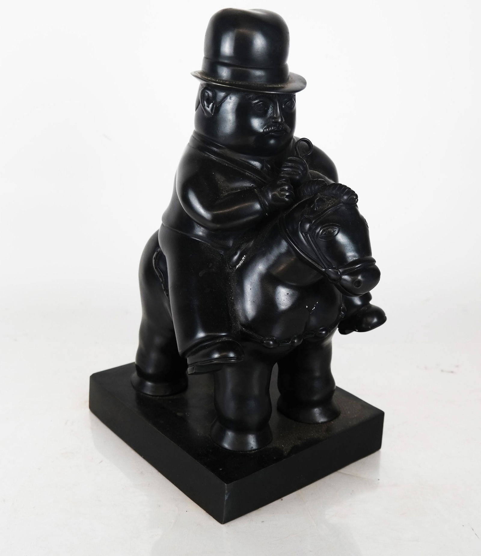 Botero-Style Bronze Man Sitting on a Horse (1 of 6)